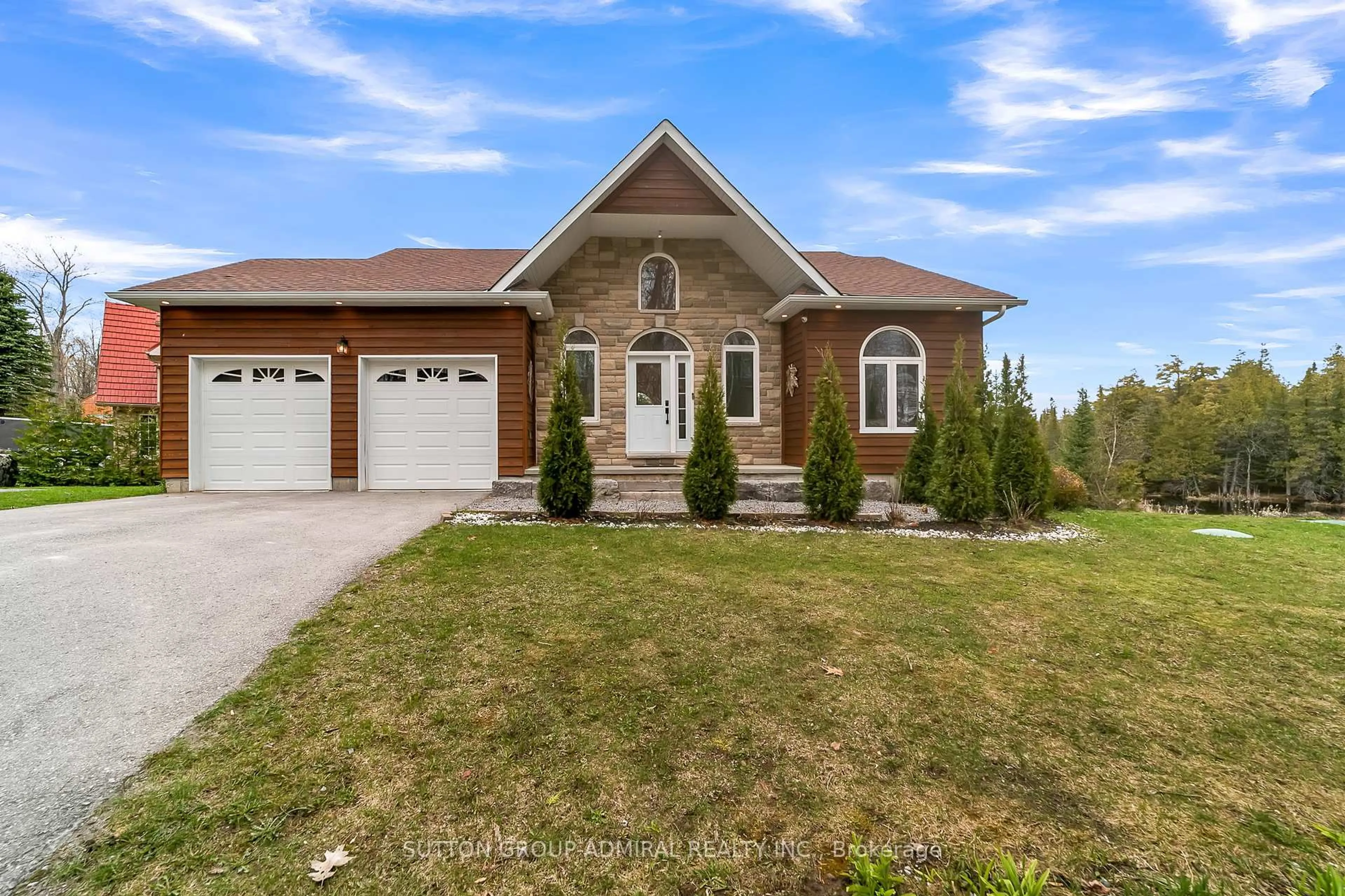 Home with brick exterior material, street for 106 Juniper Isle Rd, Kawartha Lakes Ontario K0M 1N0