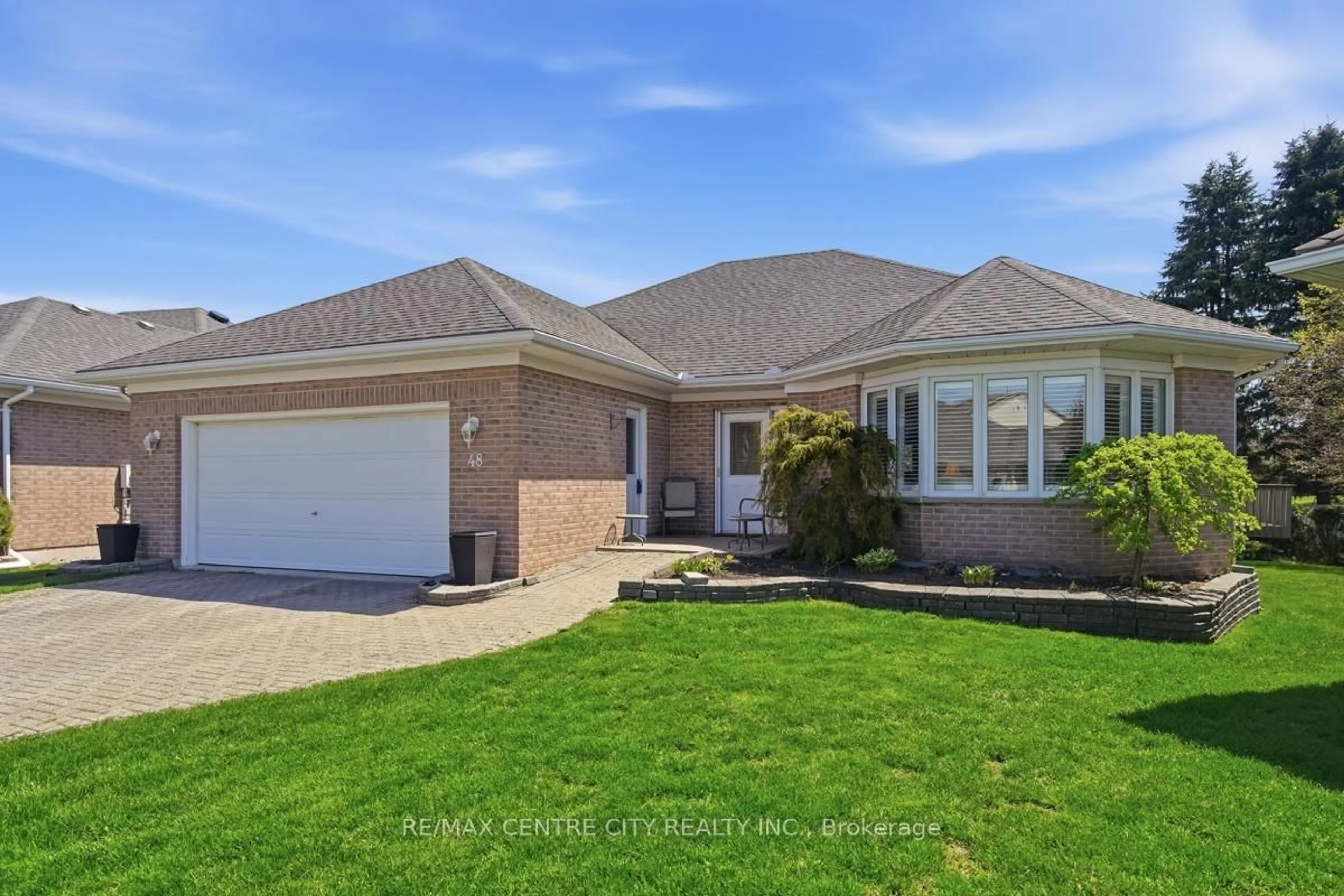 Home with brick exterior material, street for 48 Ilderbrook Circ, Middlesex Centre Ontario N0M 2A0