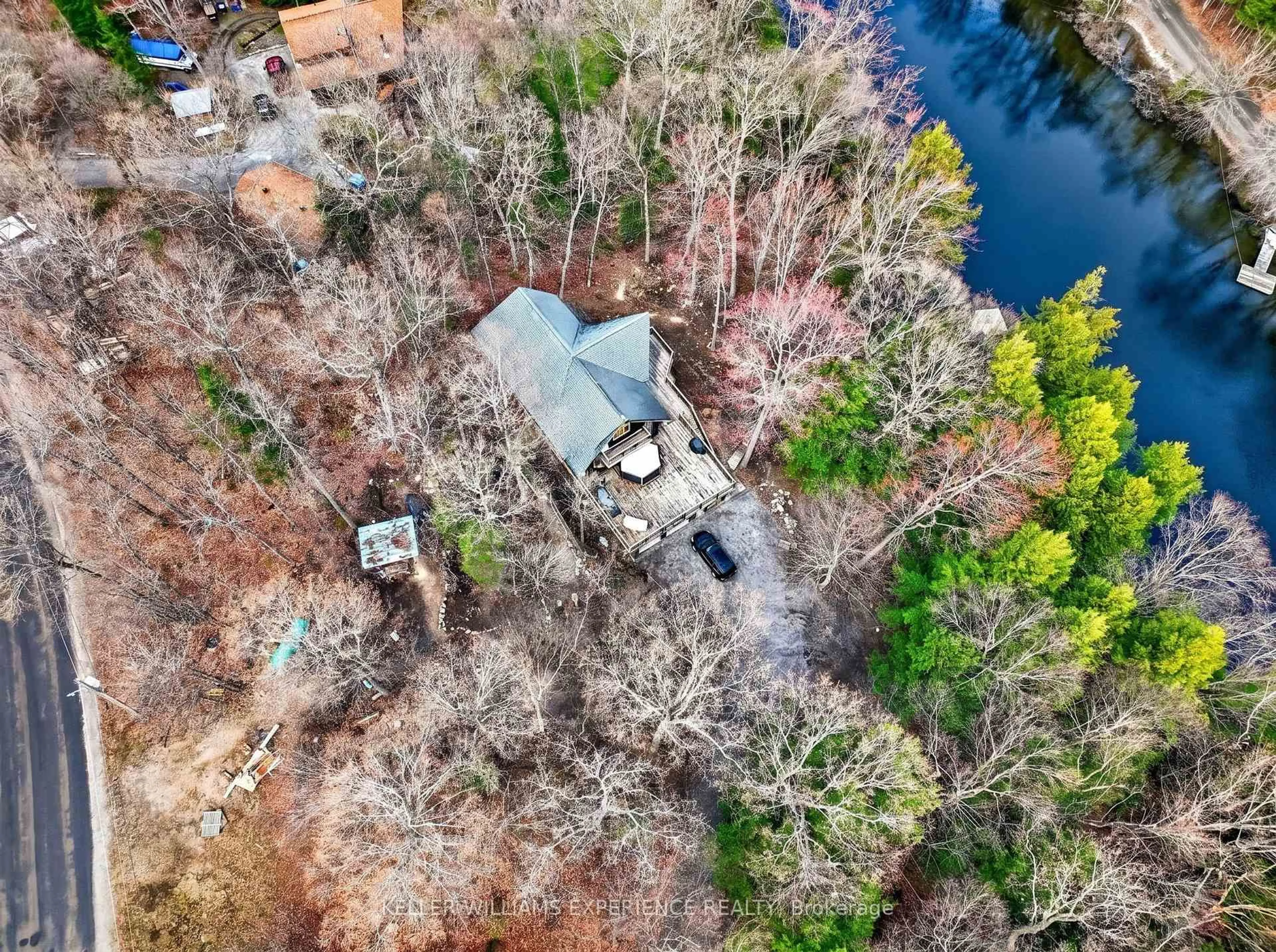 A pic from outside/outdoor area/front of a property/back of a property/a pic from drone, water/lake/river/ocean view for 1115 Sherwood Forest Rd, Bracebridge Ontario P1L 1X3