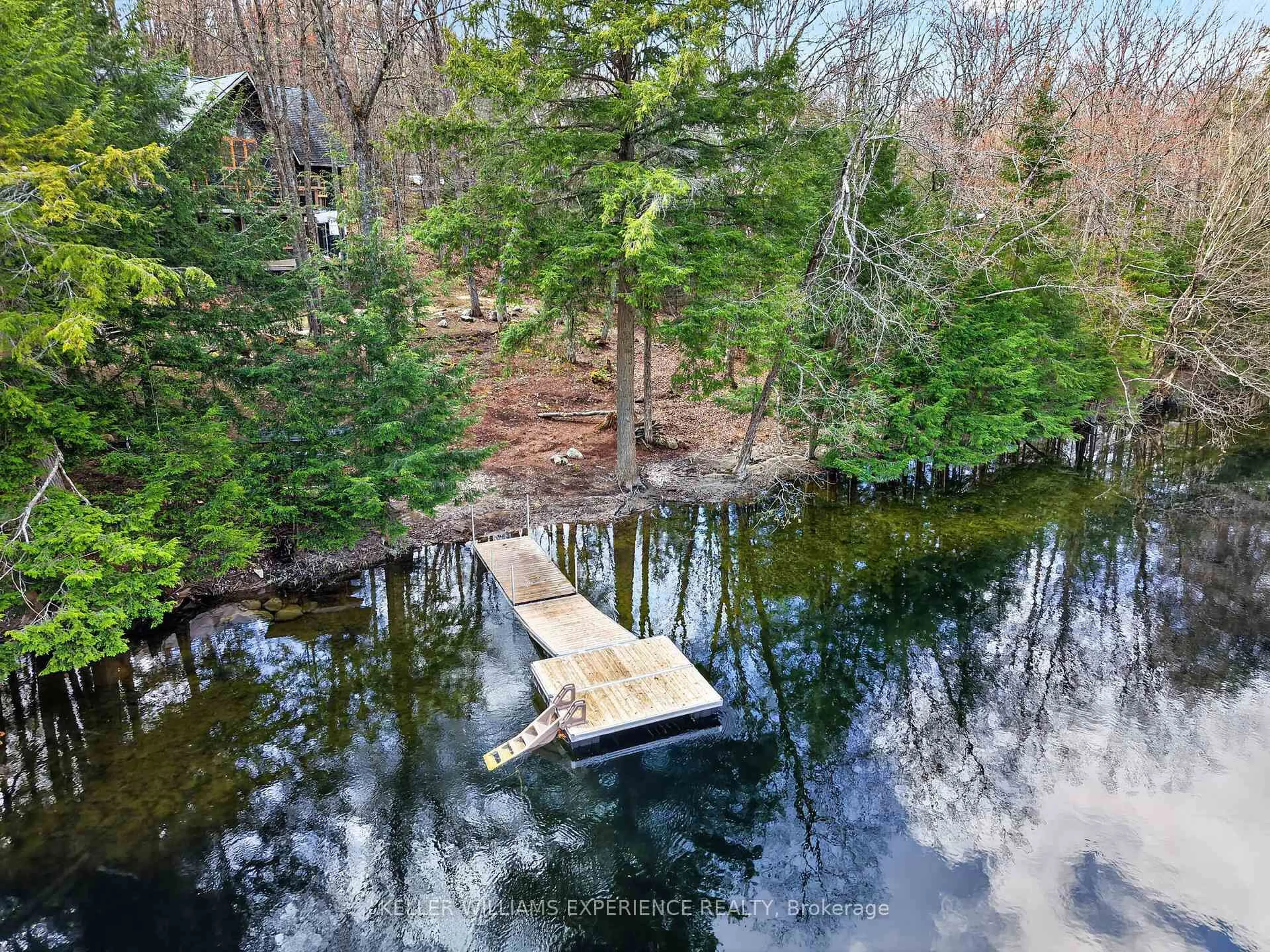 A pic from outside/outdoor area/front of a property/back of a property/a pic from drone, water/lake/river/ocean view for 1115 Sherwood Forest Rd, Bracebridge Ontario P1L 1X3