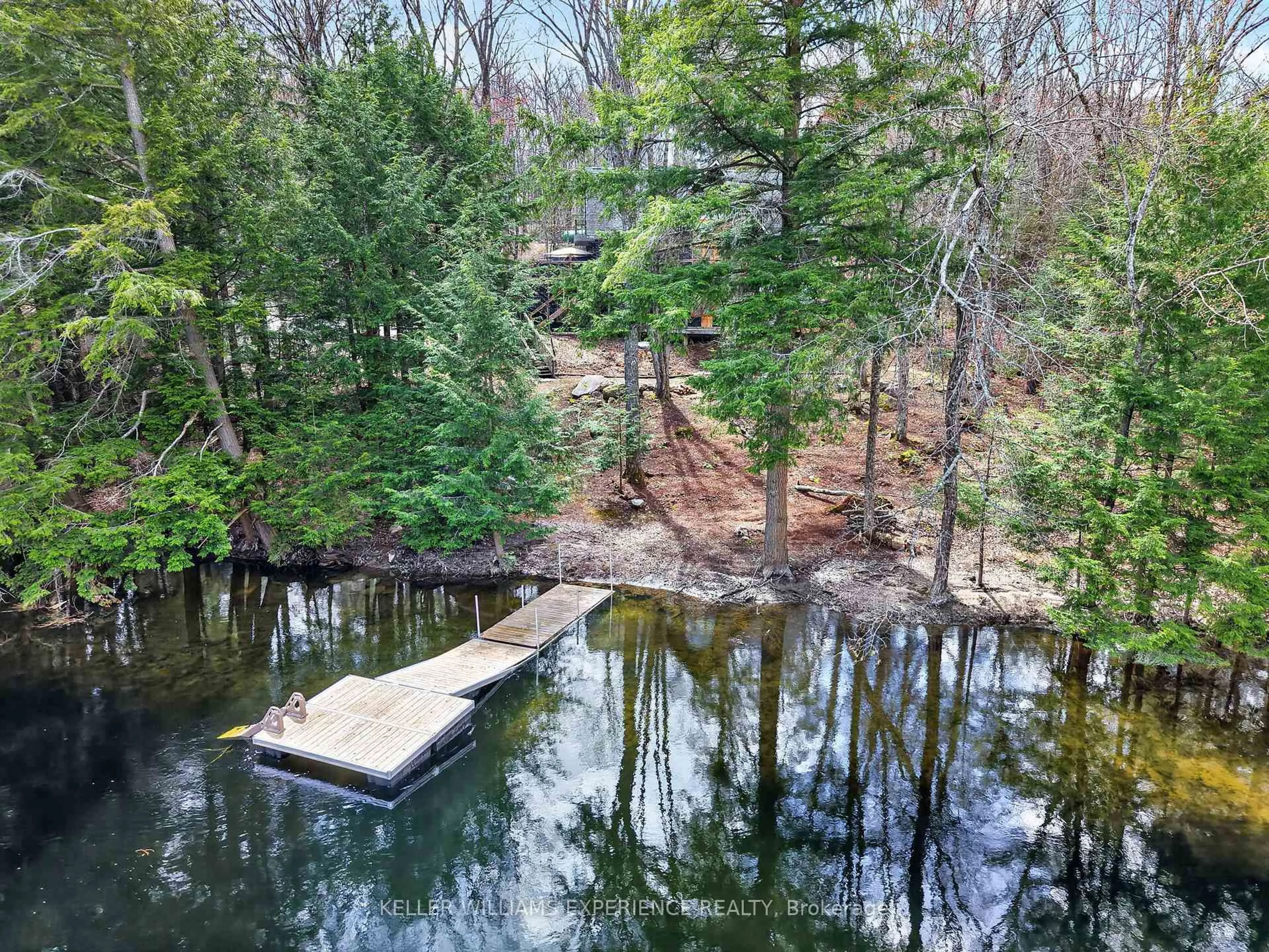 A pic from outside/outdoor area/front of a property/back of a property/a pic from drone, water/lake/river/ocean view for 1115 Sherwood Forest Rd, Bracebridge Ontario P1L 1X3