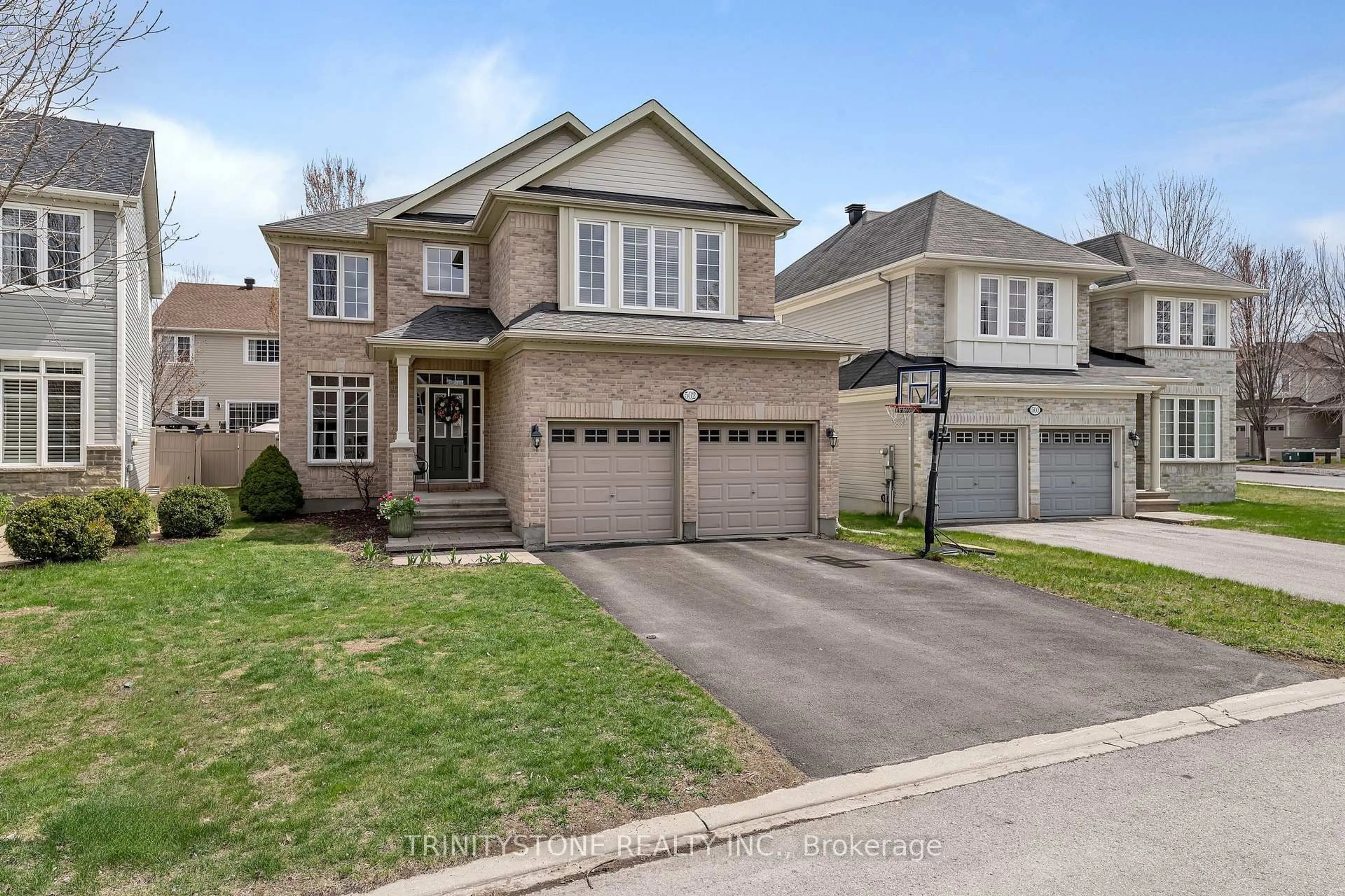 Home with brick exterior material, street for 502 Dalewood Cres, Stittsville Ontario K2S 0L2