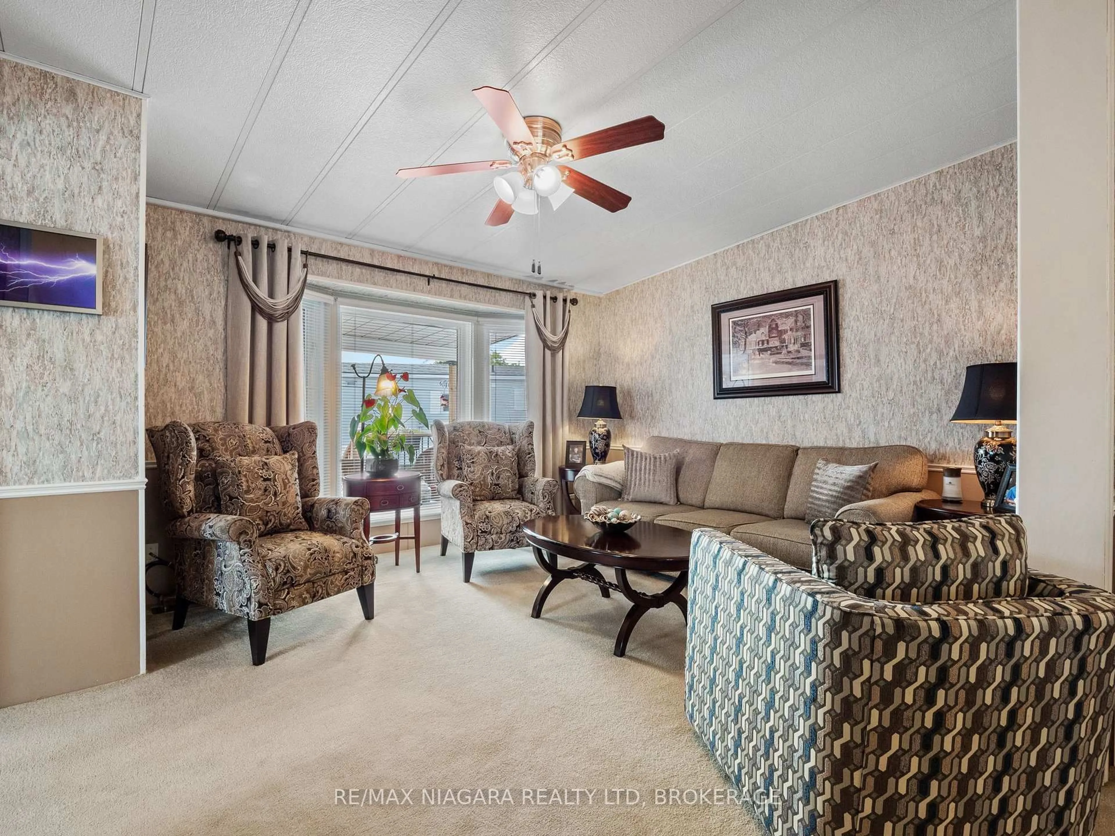 Living room with furniture, unknown for 3033 Townline Rd #317, Fort Erie Ontario L0S 1S1