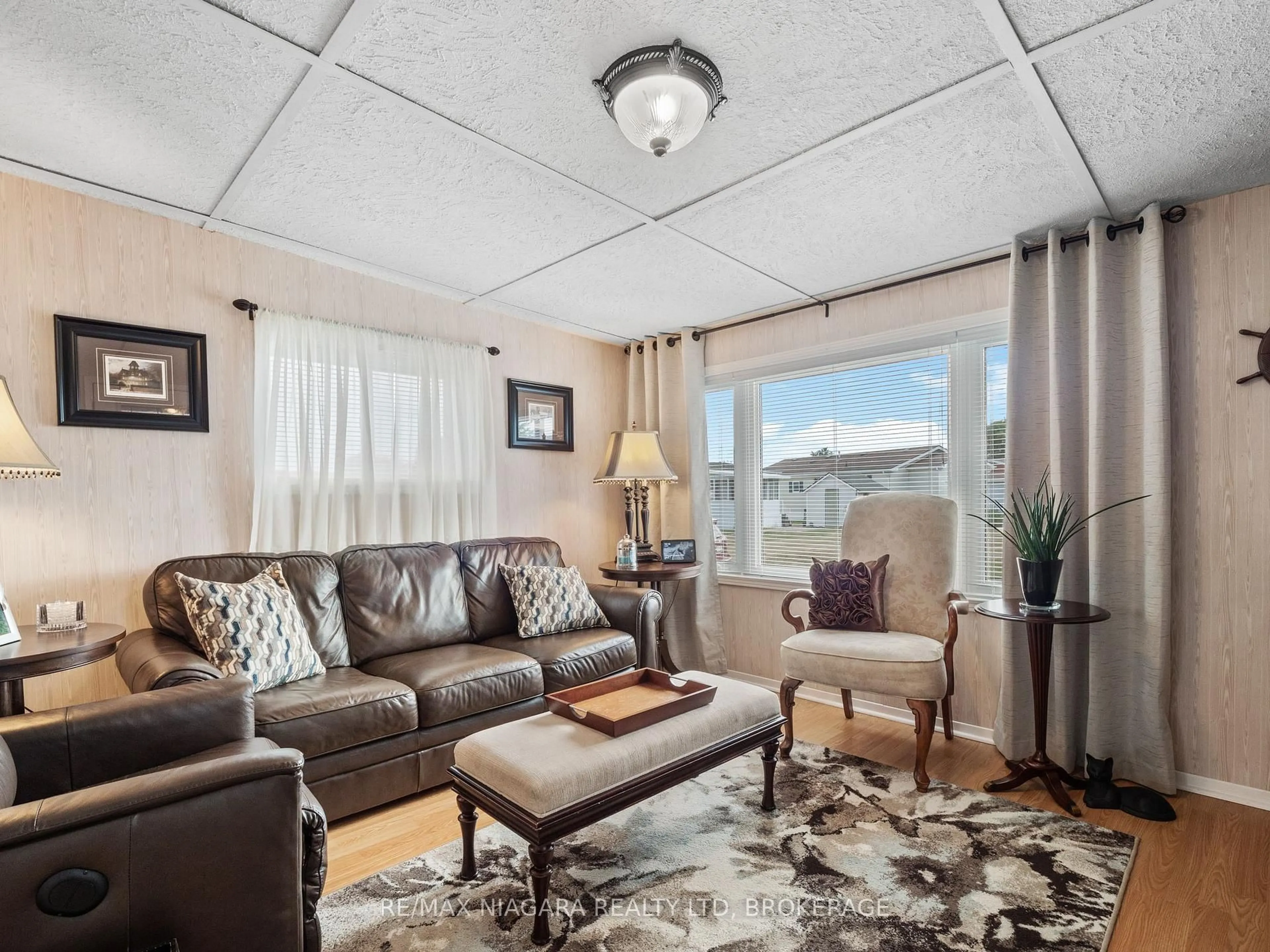 Living room with furniture, unknown for 3033 Townline Rd #317, Fort Erie Ontario L0S 1S1