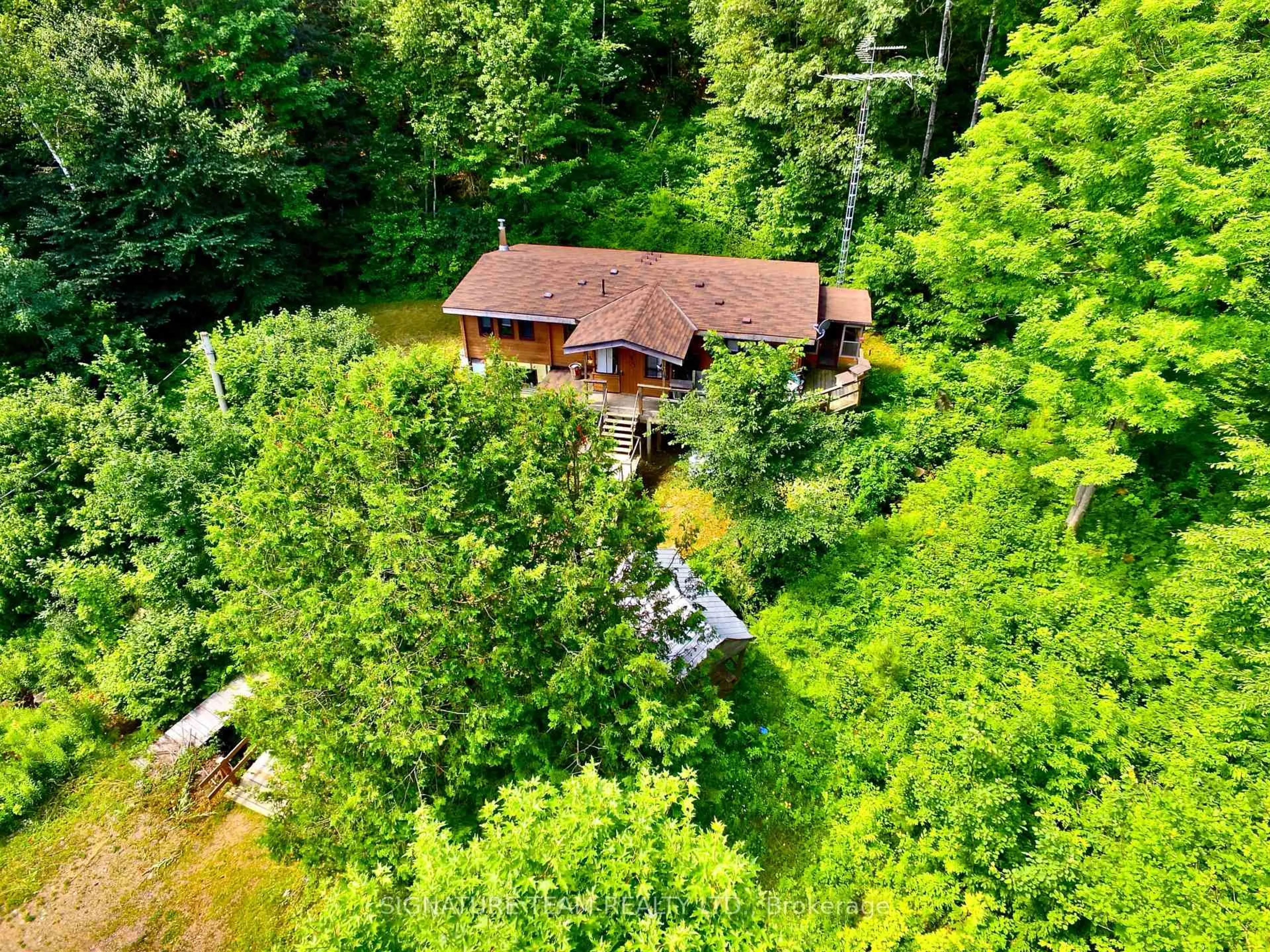 A pic from outside/outdoor area/front of a property/back of a property/a pic from drone, forest/trees view for 19626 41 Highway, Cloyne Ontario K0H 1K0