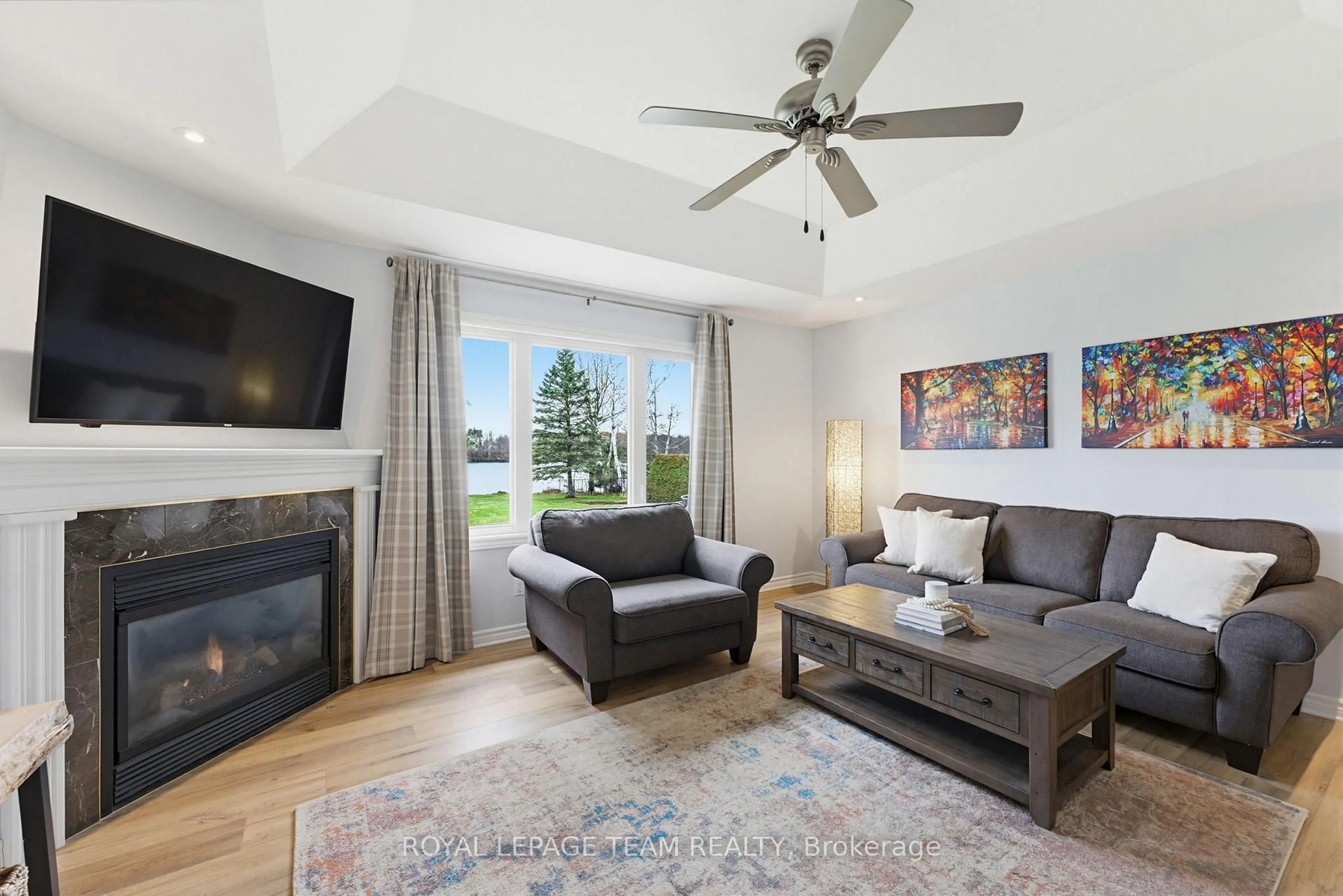 Living room with furniture, wood/laminate floor for 2141 River Rd, North Grenville Ontario K0G 1J0