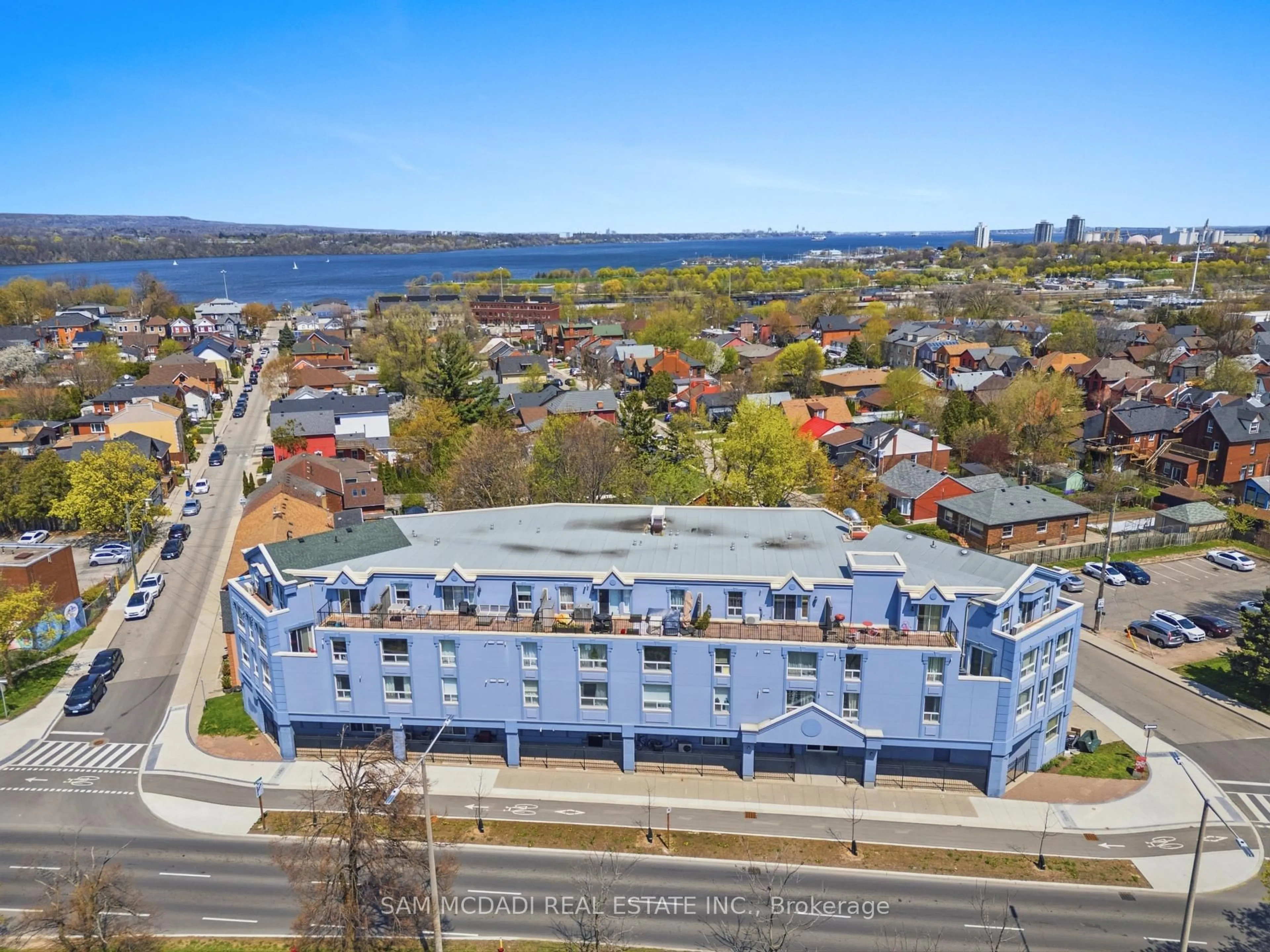 A pic from outside/outdoor area/front of a property/back of a property/a pic from drone, water/lake/river/ocean view for 400 York Blvd #201, Hamilton Ontario L8R 3M5