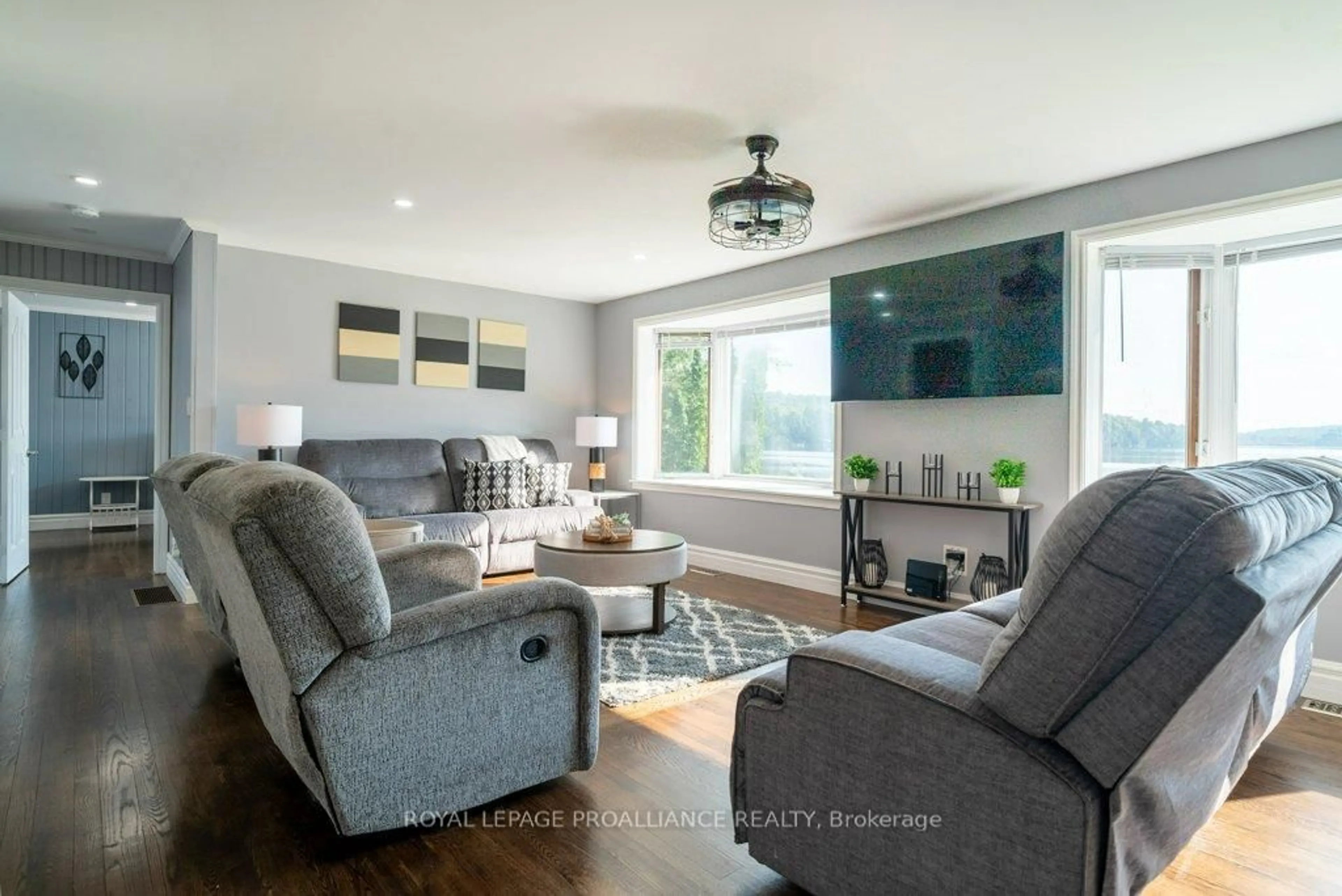 Living room with furniture, wood/laminate floor for 1049 Perry Lane, Cloyne Ontario K0H 1K0