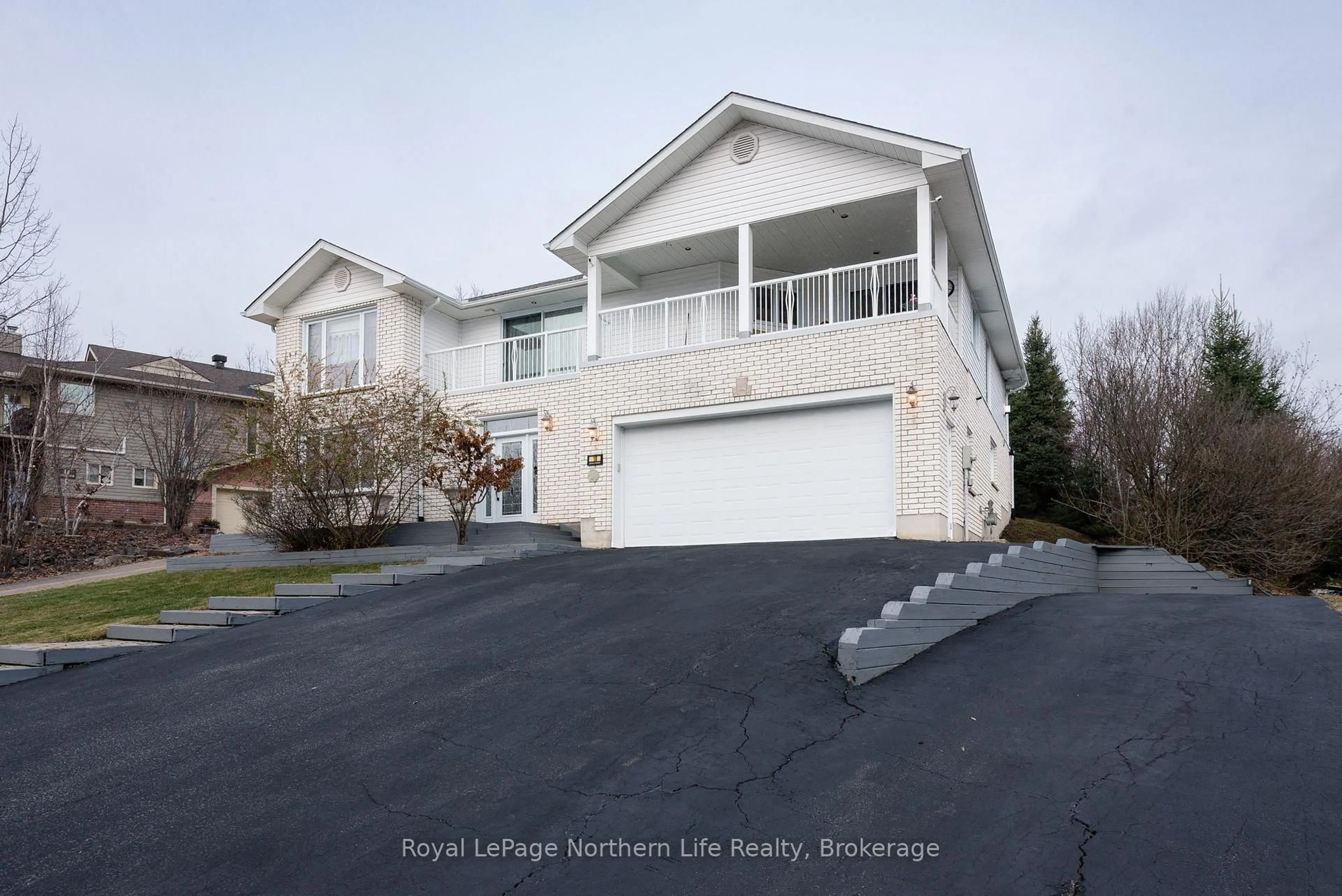Home with vinyl exterior material, street for 18 Killare St, North Bay Ontario P1A 4J2