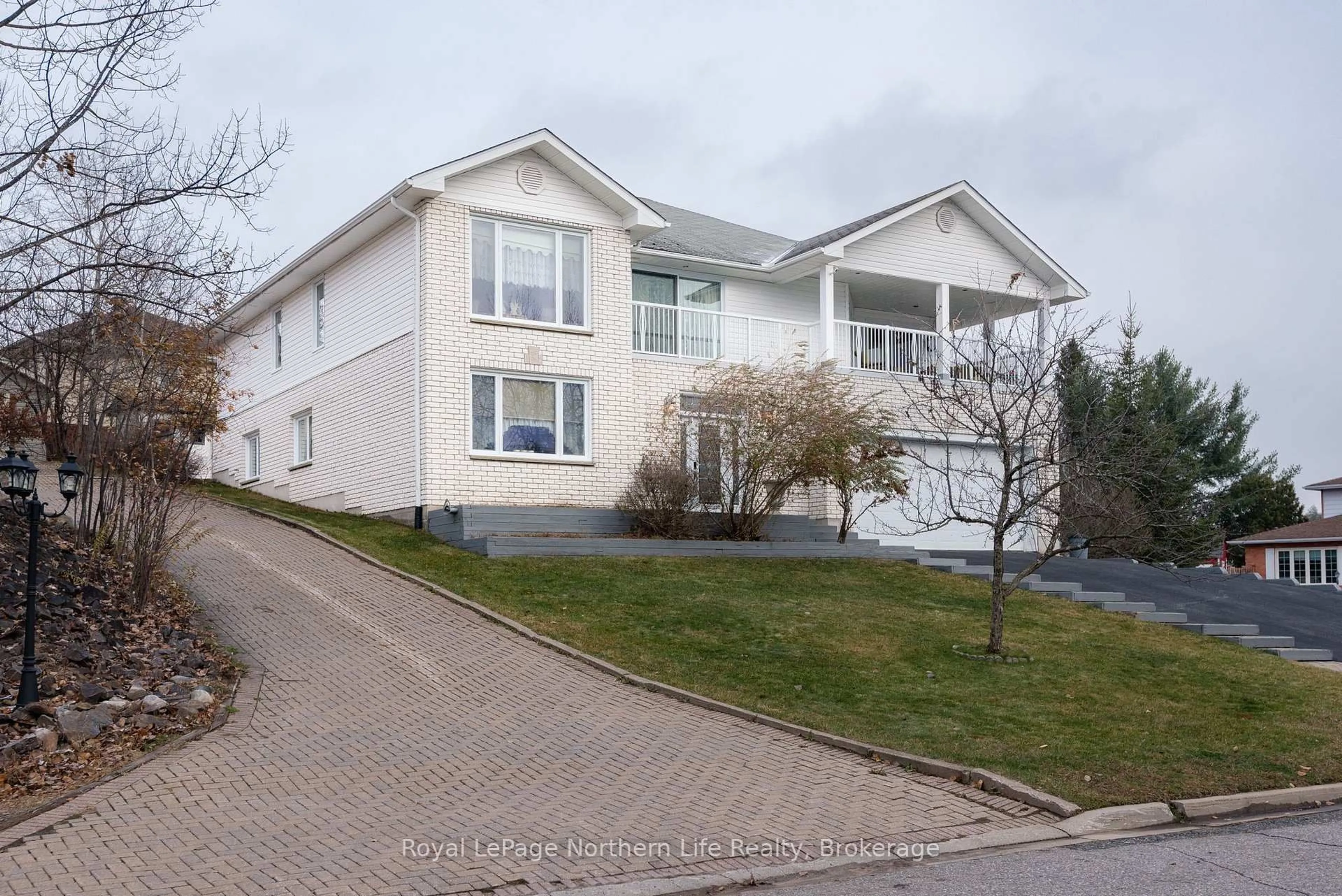 Home with vinyl exterior material, street for 18 Killare St, North Bay Ontario P1A 4J2