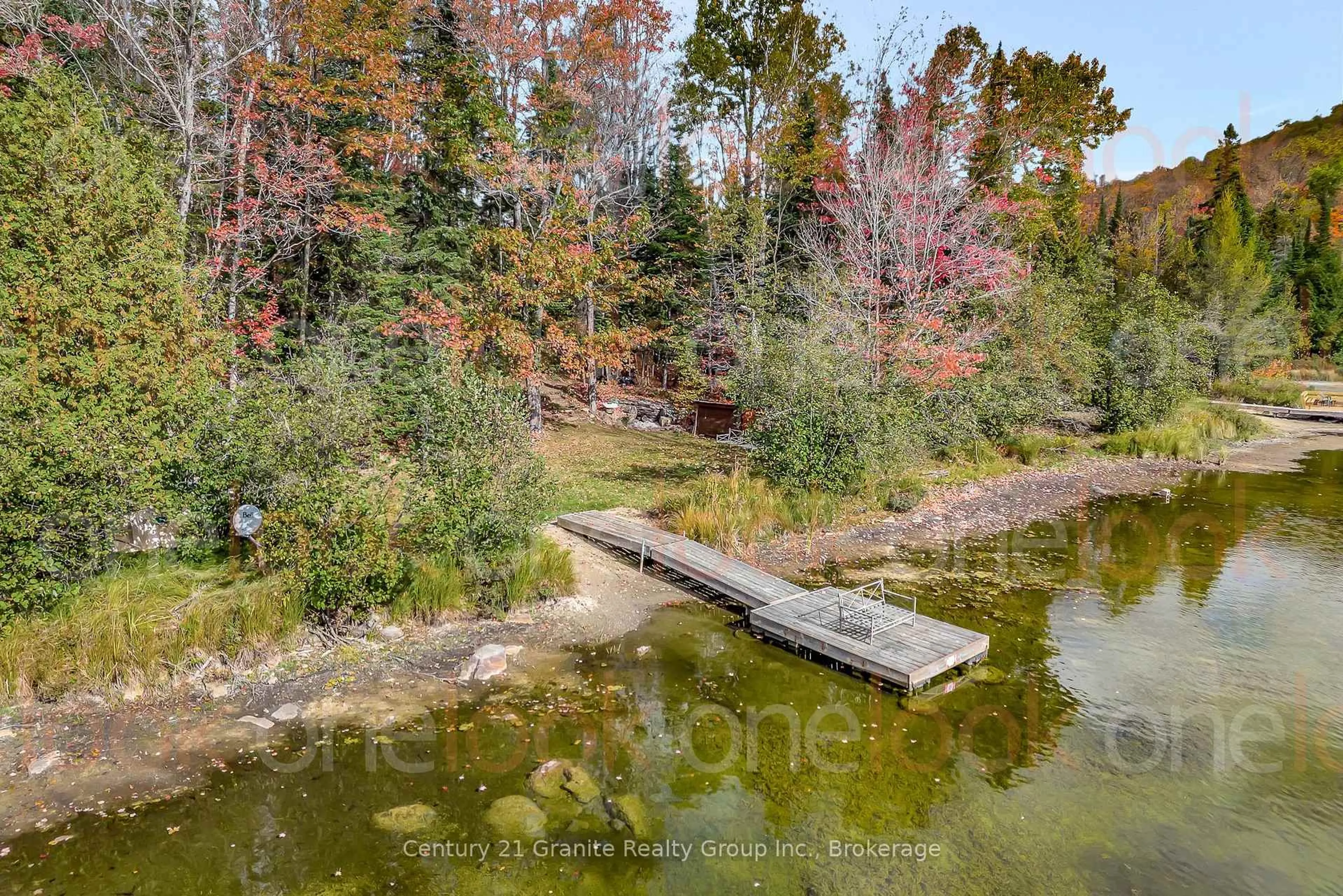A pic from outside/outdoor area/front of a property/back of a property/a pic from drone, water/lake/river/ocean view for 1081 Cinnamon Lane, Minden Hills Ontario K0M 2K0