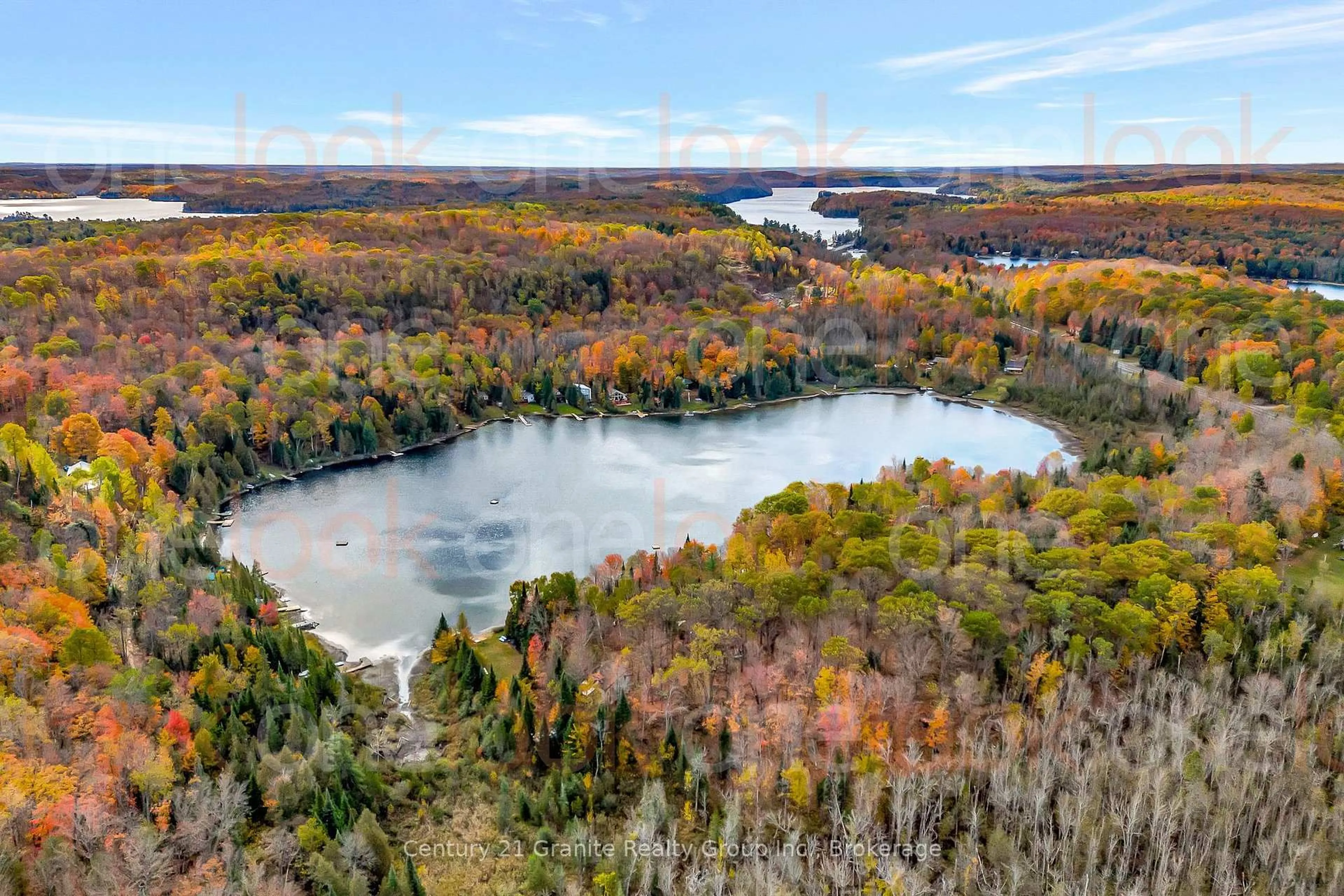 A pic from outside/outdoor area/front of a property/back of a property/a pic from drone, water/lake/river/ocean view for 1081 Cinnamon Lane, Minden Hills Ontario K0M 2K0
