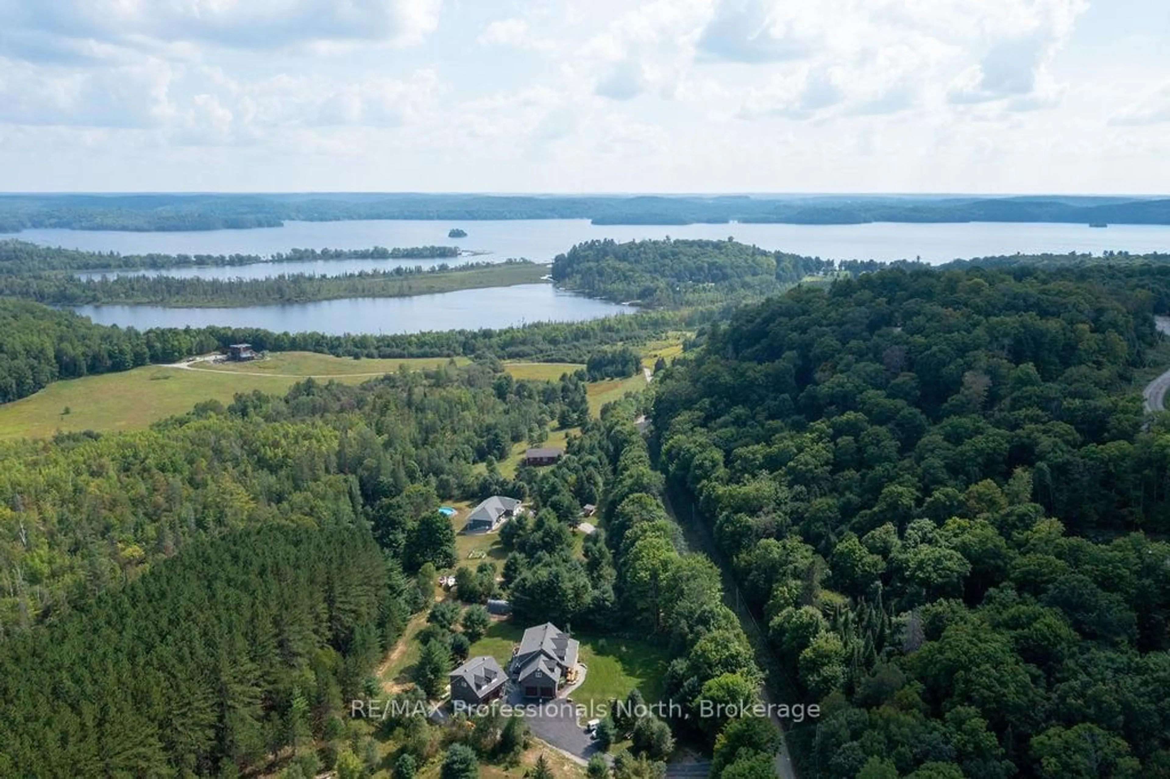 A pic from outside/outdoor area/front of a property/back of a property/a pic from drone, water/lake/river/ocean view for 427 Skyhills Rd, Huntsville Ontario P1H 2N5