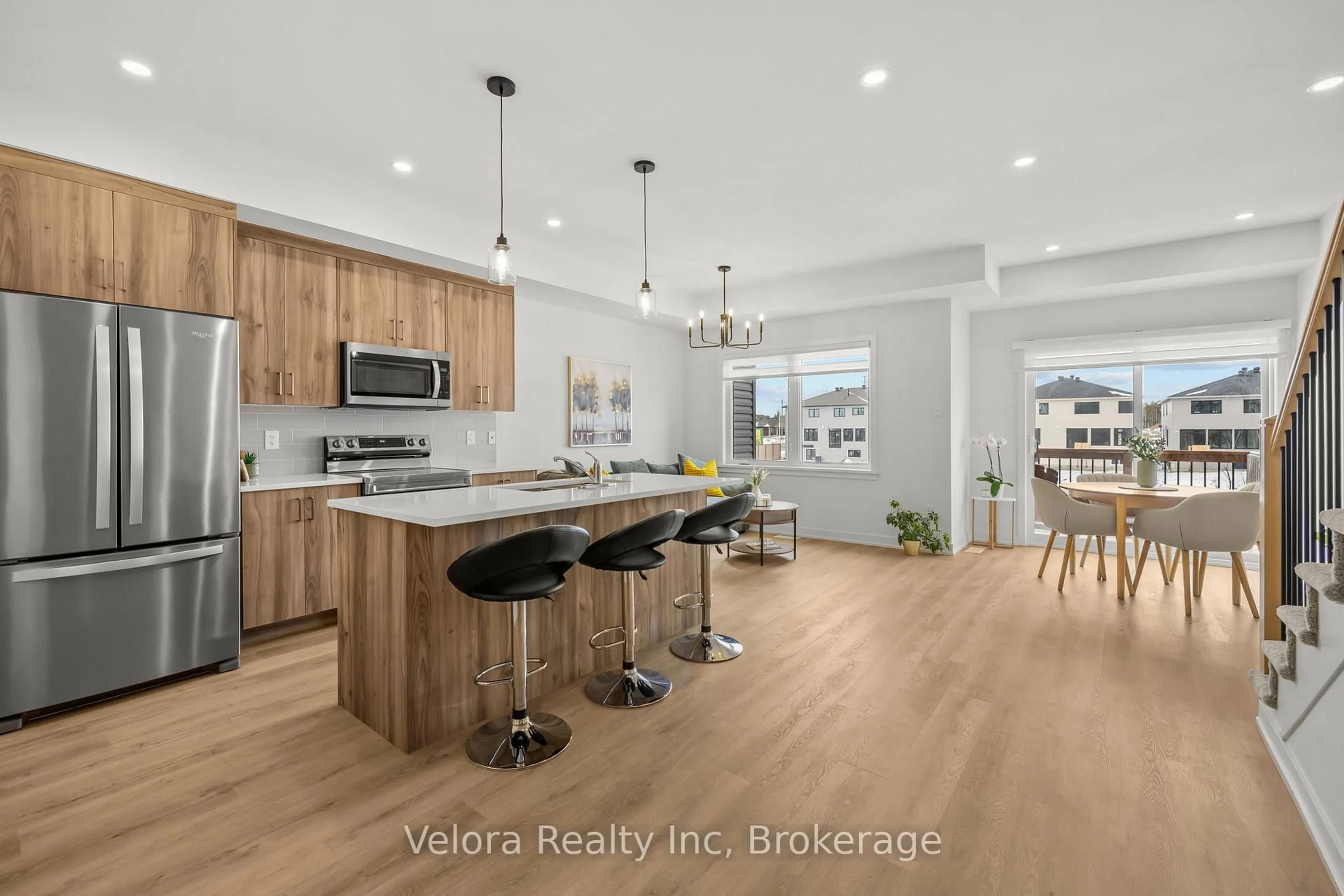 Open concept kitchen, wood/laminate floor for 1224 Cope Dr, Ottawa Ontario K2S 3C4