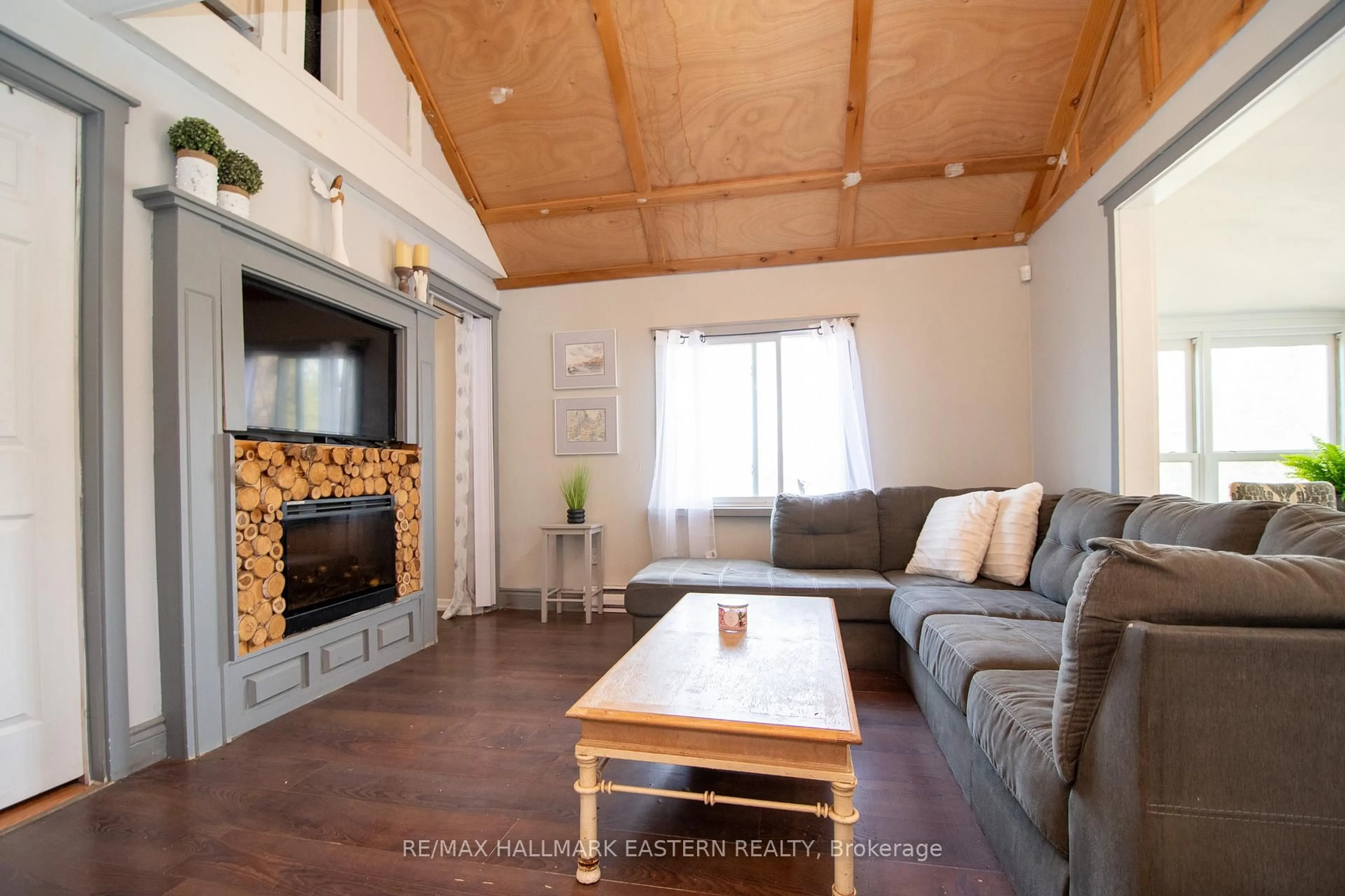Living room with furniture, wood/laminate floor for 2305 Thurstonia Rd, Kawartha Lakes Ontario K0M 1L0