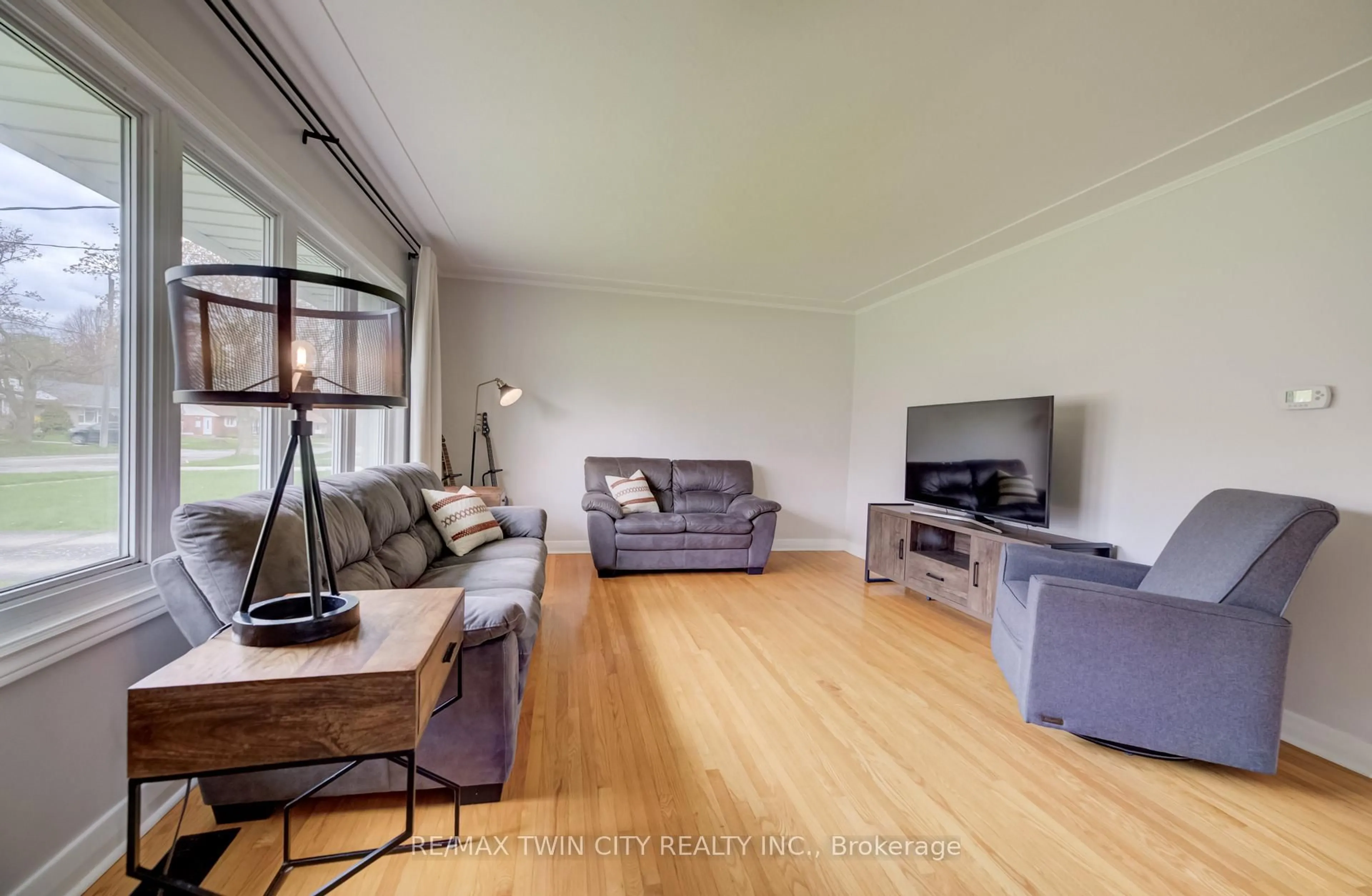 Living room with furniture, wood/laminate floor for 57 Jack Ave, Kitchener Ontario N2M 1Z9