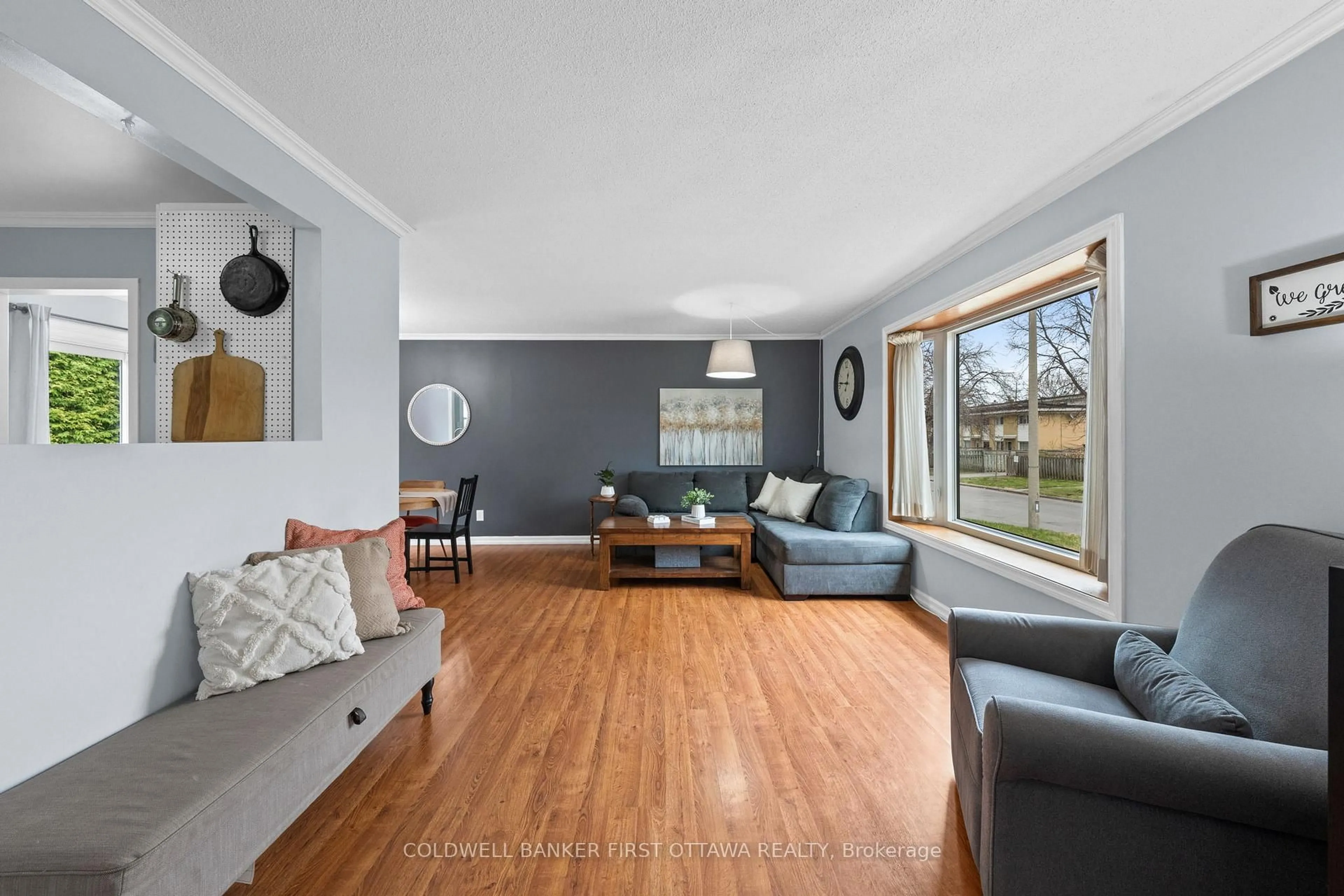 Living room with furniture, wood/laminate floor for 2681 Moncton Rd, Ottawa Ontario K2B 7V9