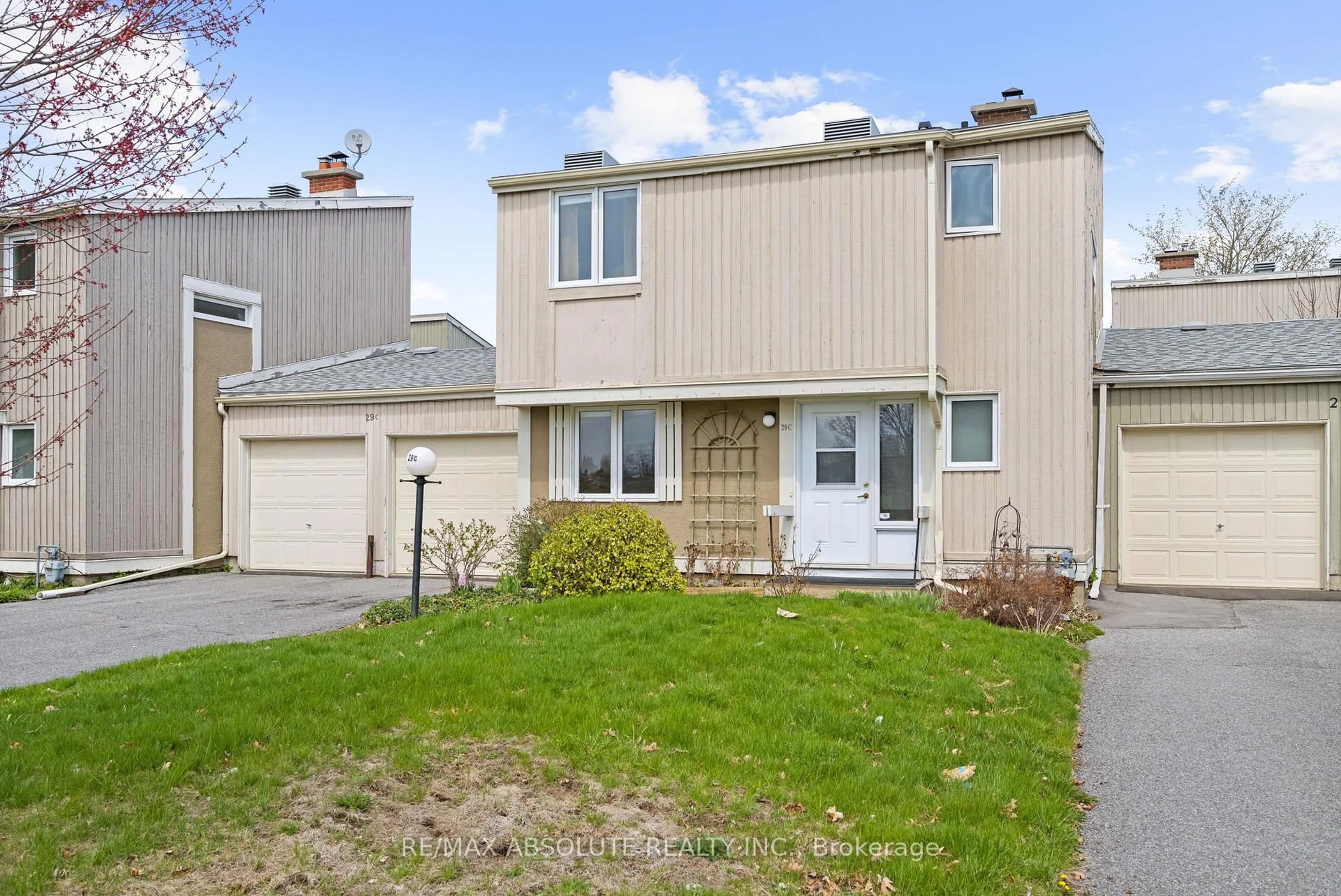 Home with vinyl exterior material, street for 29C Varley Dr #C, Ottawa Ontario K2K 1G4
