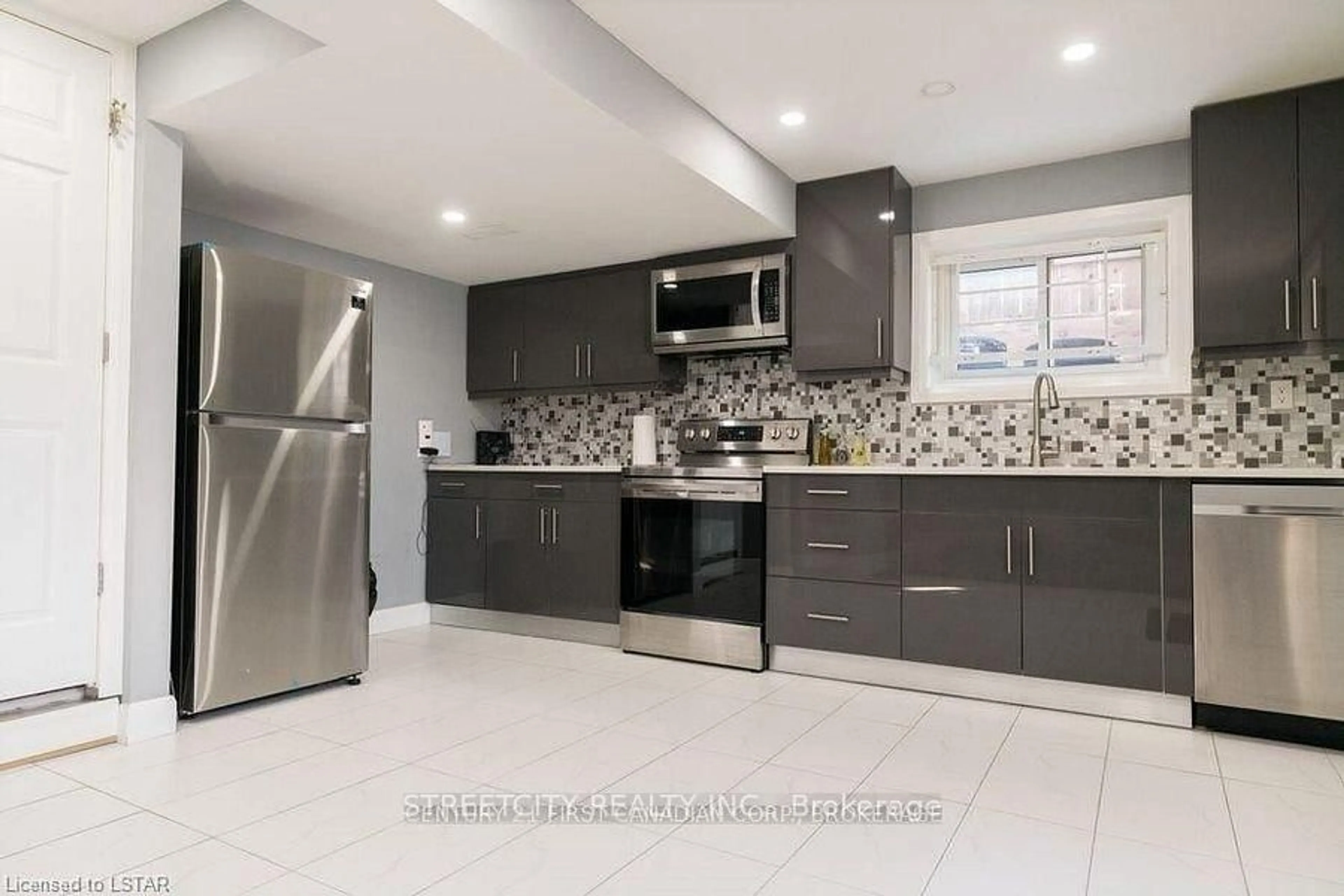 Open concept kitchen, ceramic/tile floor for 43 Renny Cres, London South Ontario N6E 2C4