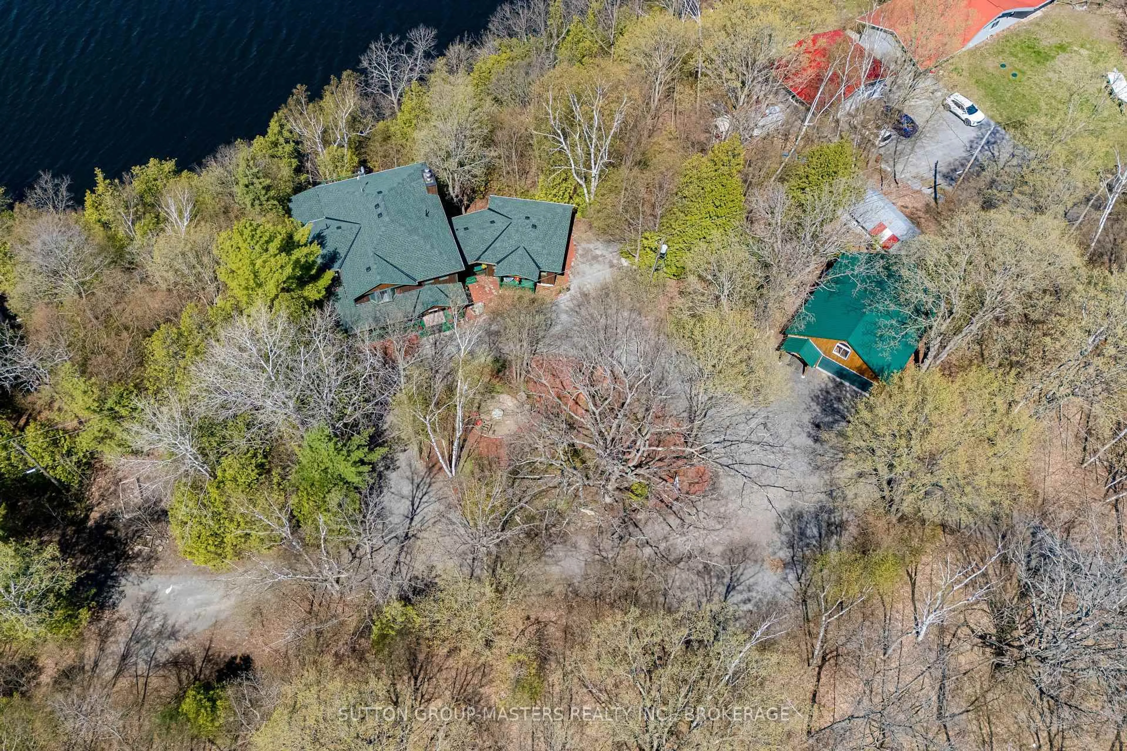A pic from outside/outdoor area/front of a property/back of a property/a pic from drone, water/lake/river/ocean view for 1130 Storms Lane, Hartington Ontario K0H 1W0