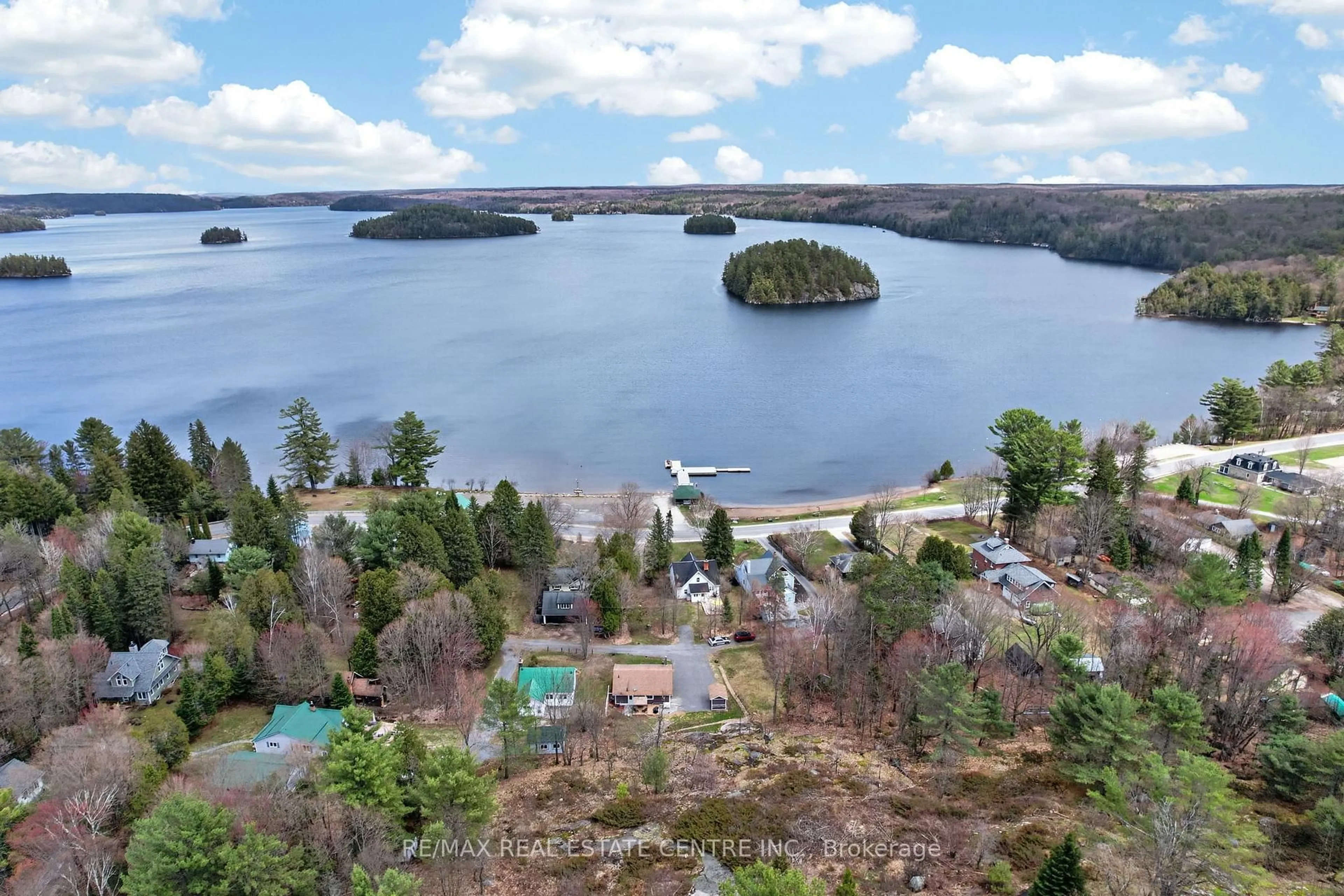 A pic from outside/outdoor area/front of a property/back of a property/a pic from drone, water/lake/river/ocean view for 17 MCCLURE Lane, Huntsville Ontario P0B 1L0