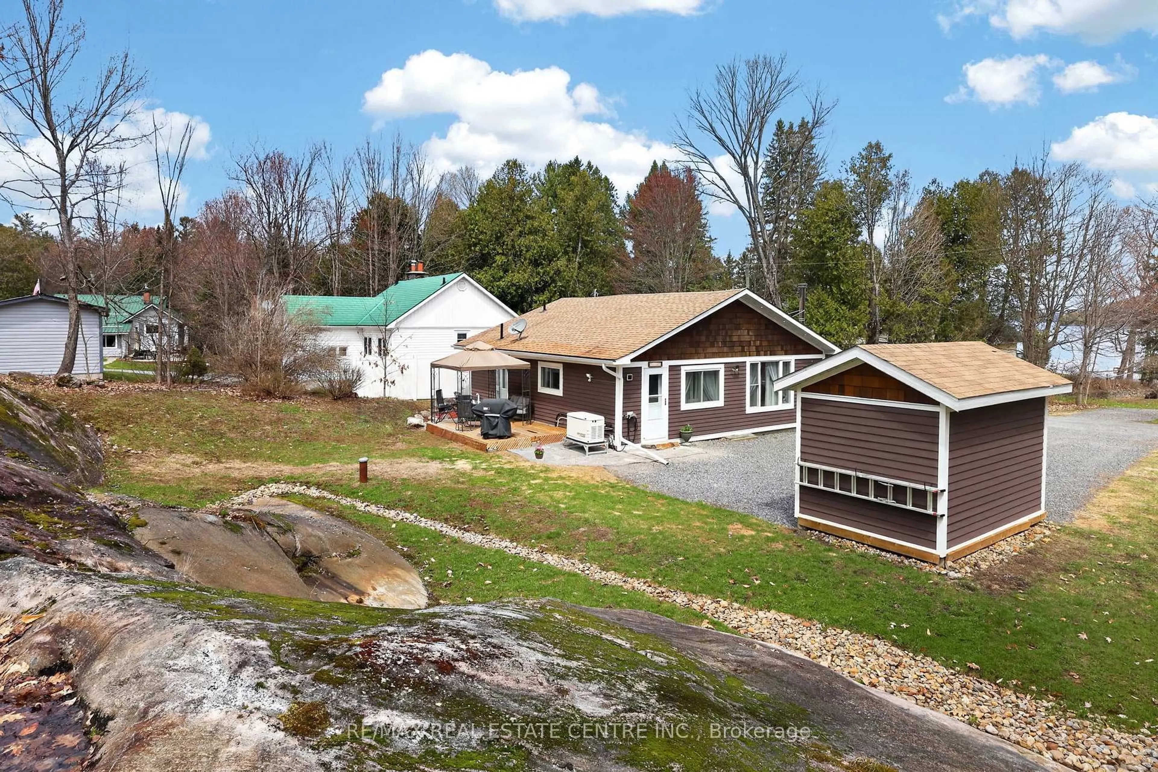 A pic from outside/outdoor area/front of a property/back of a property/a pic from drone, unknown for 17 MCCLURE Lane, Huntsville Ontario P0B 1L0