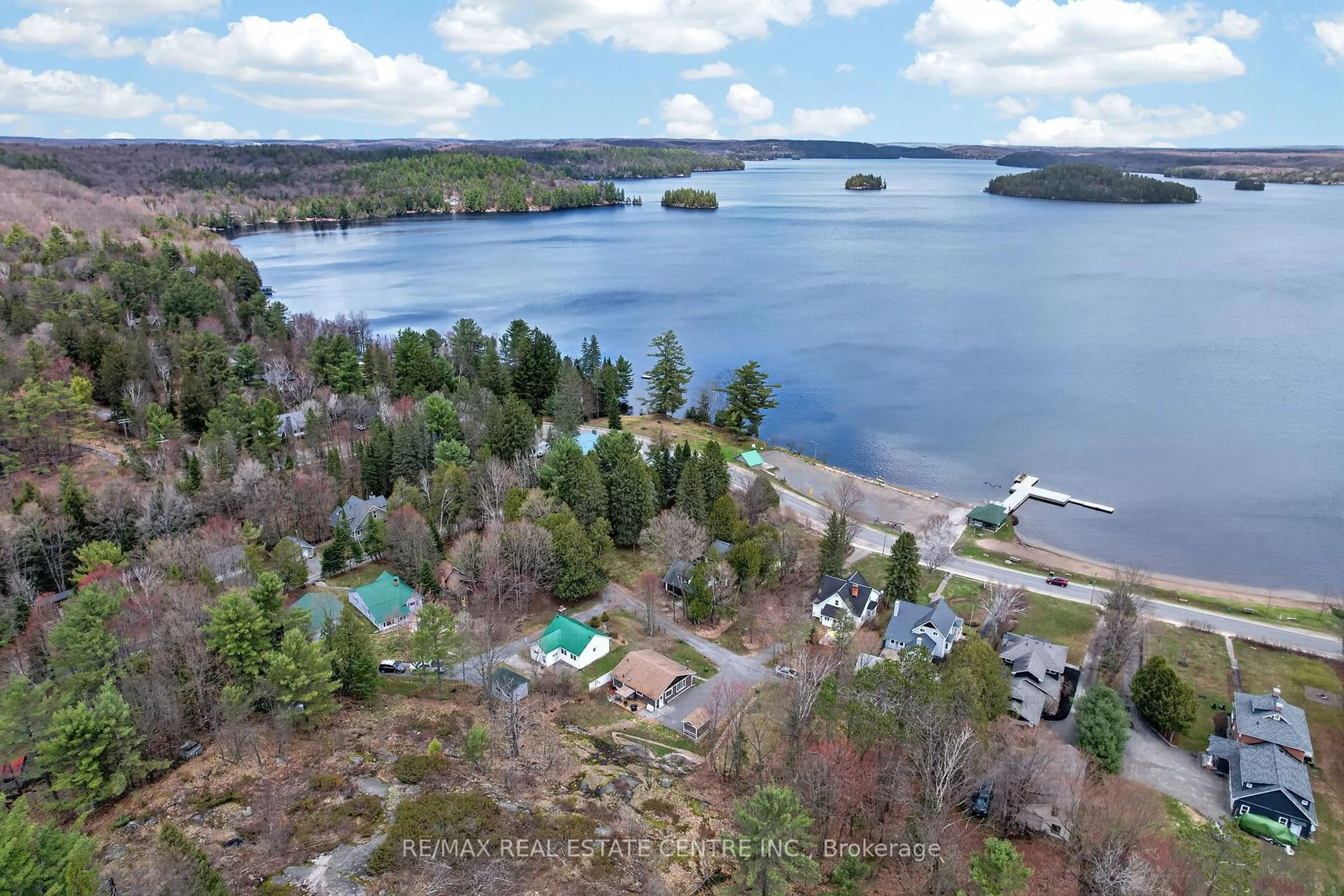 A pic from outside/outdoor area/front of a property/back of a property/a pic from drone, water/lake/river/ocean view for 17 MCCLURE Lane, Huntsville Ontario P0B 1L0