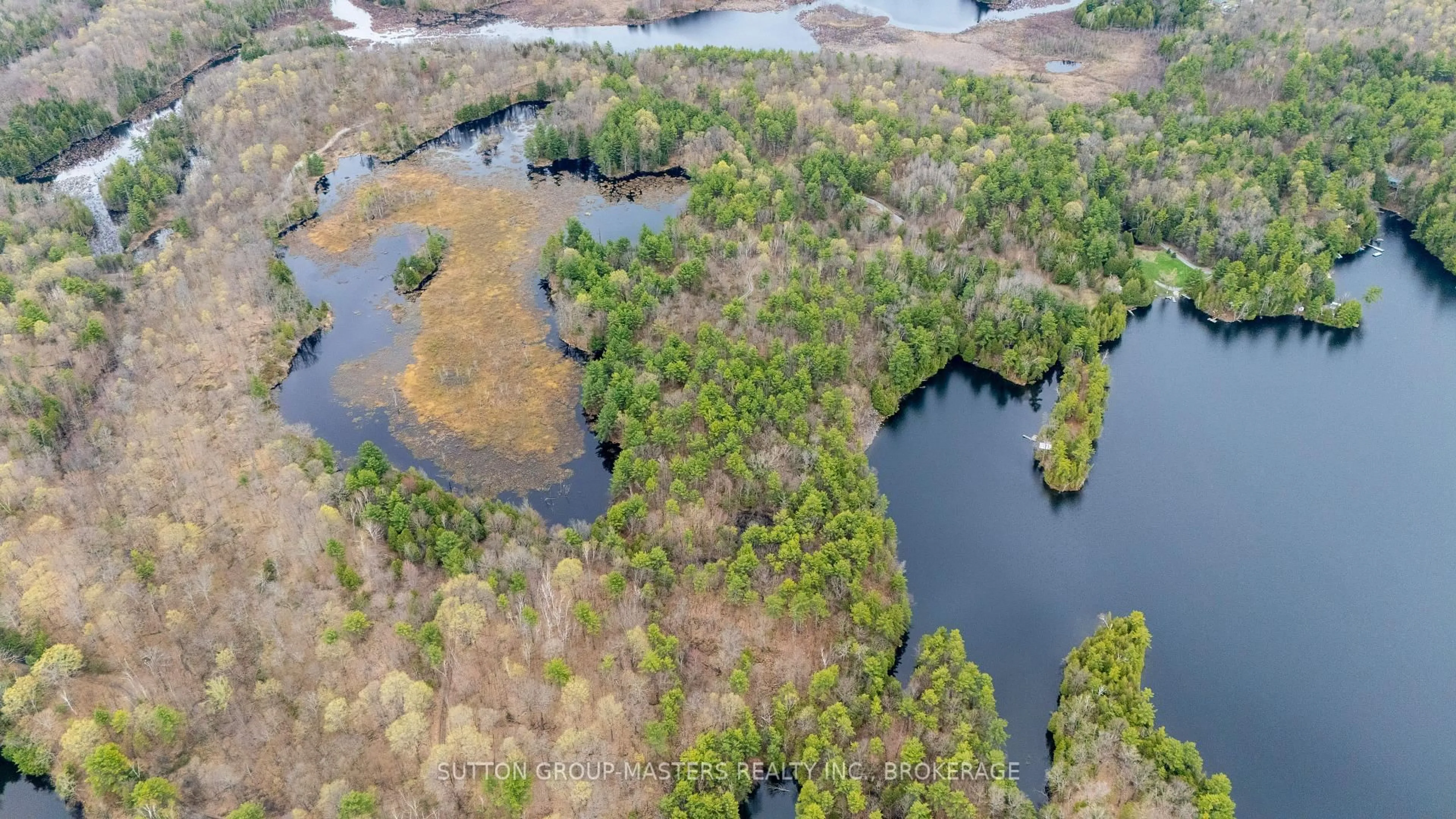 A pic from outside/outdoor area/front of a property/back of a property/a pic from drone, water/lake/river/ocean view for 1131 Willy's Lane, Hartington Ontario K0H 1W0
