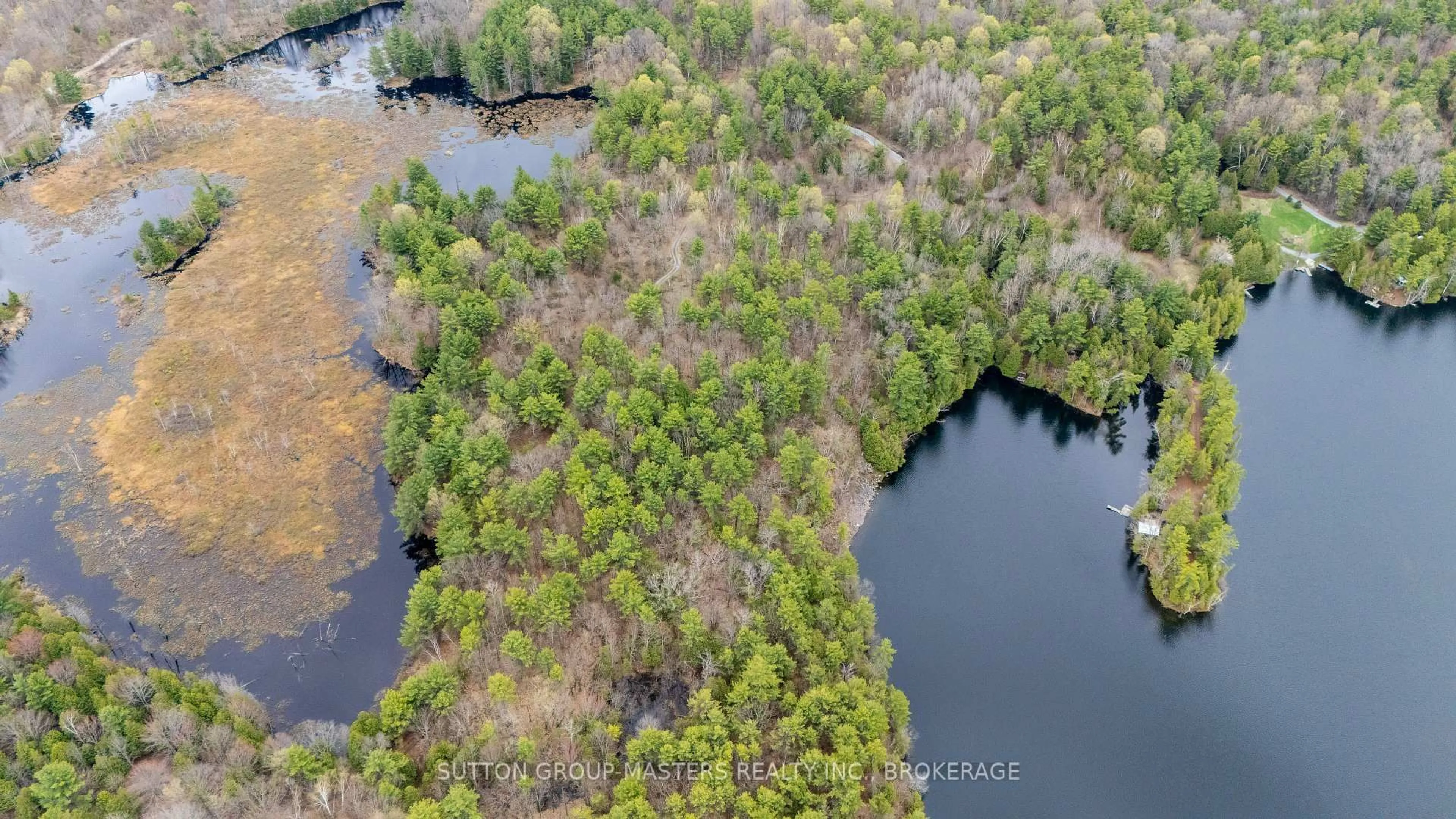 A pic from outside/outdoor area/front of a property/back of a property/a pic from drone, water/lake/river/ocean view for 1131 Willy's Lane, Hartington Ontario K0H 1W0