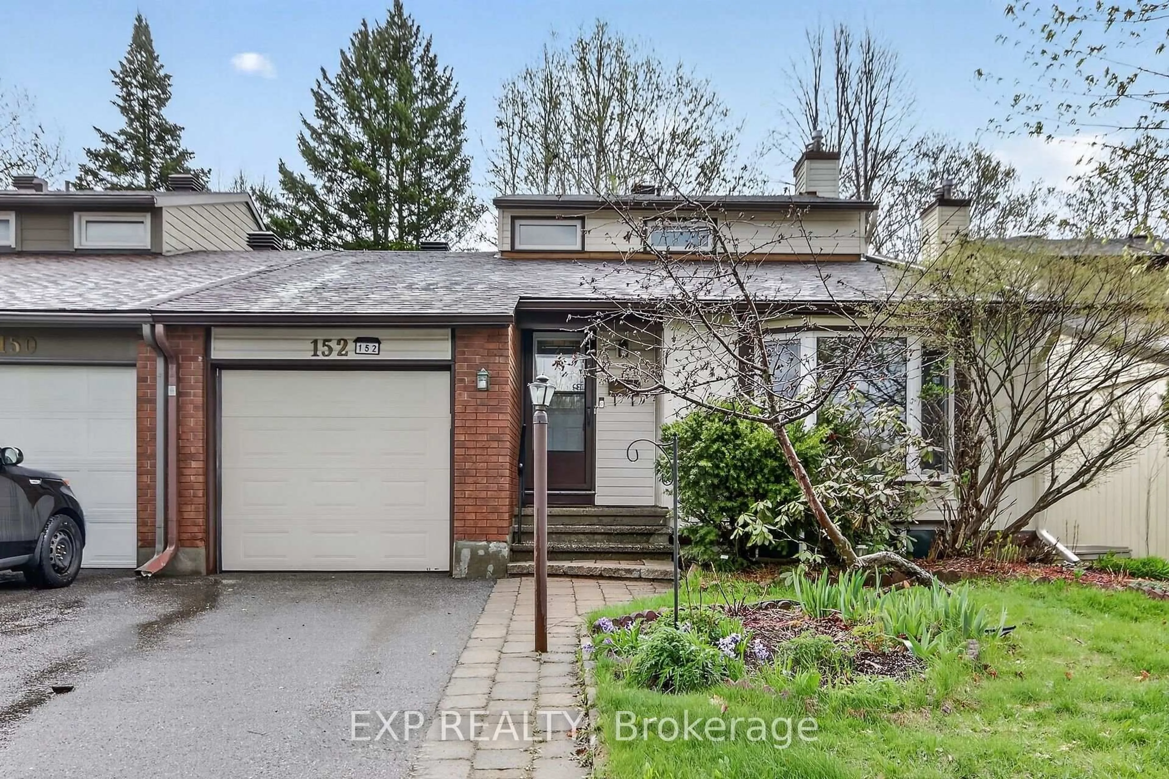 Home with brick exterior material, street for 152 Burnetts Gr Circ, Ottawa Ontario K2J 1S9