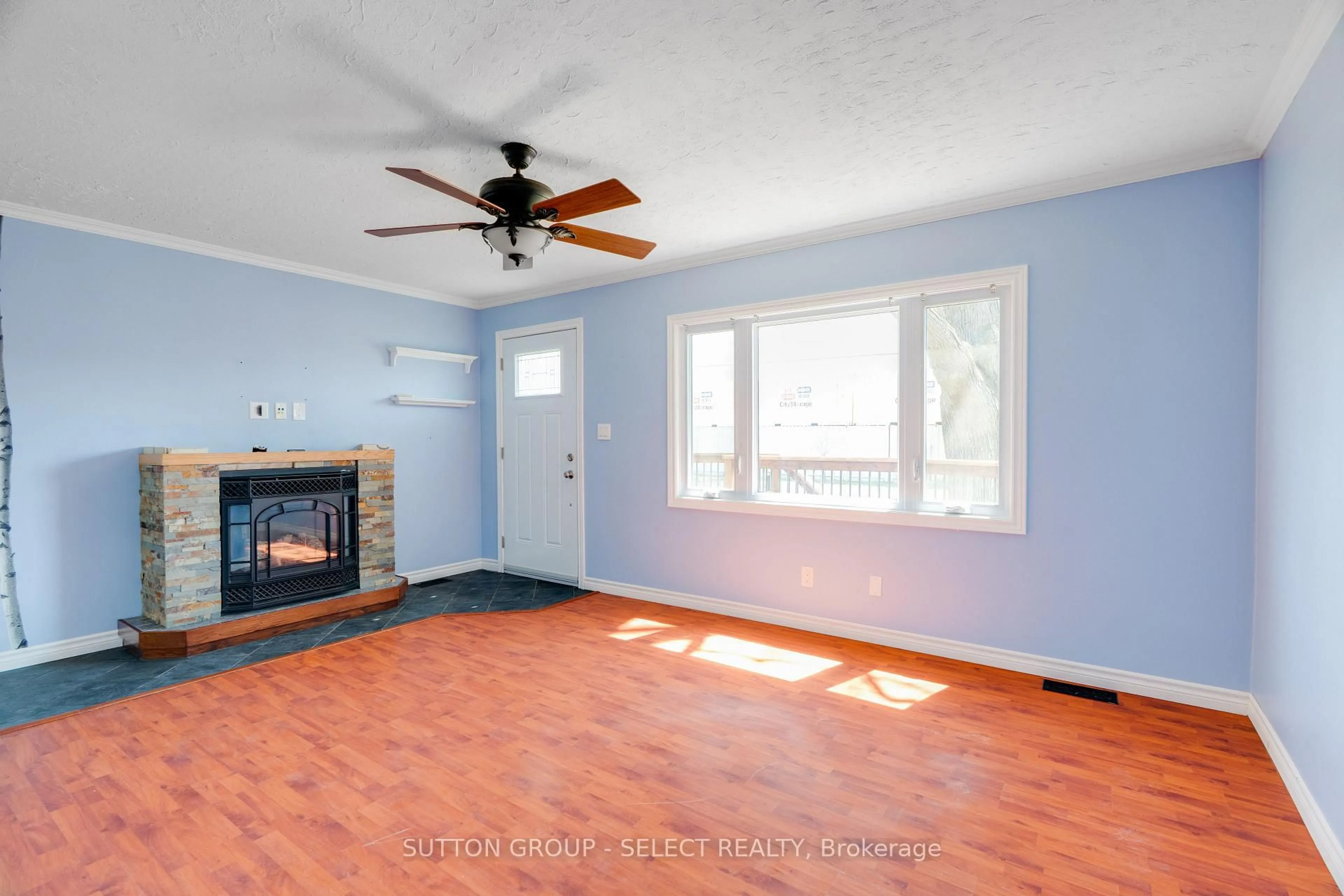 Living room with furniture, wood/laminate floor for 1242 Brydges St, London East Ontario N5W 2C1