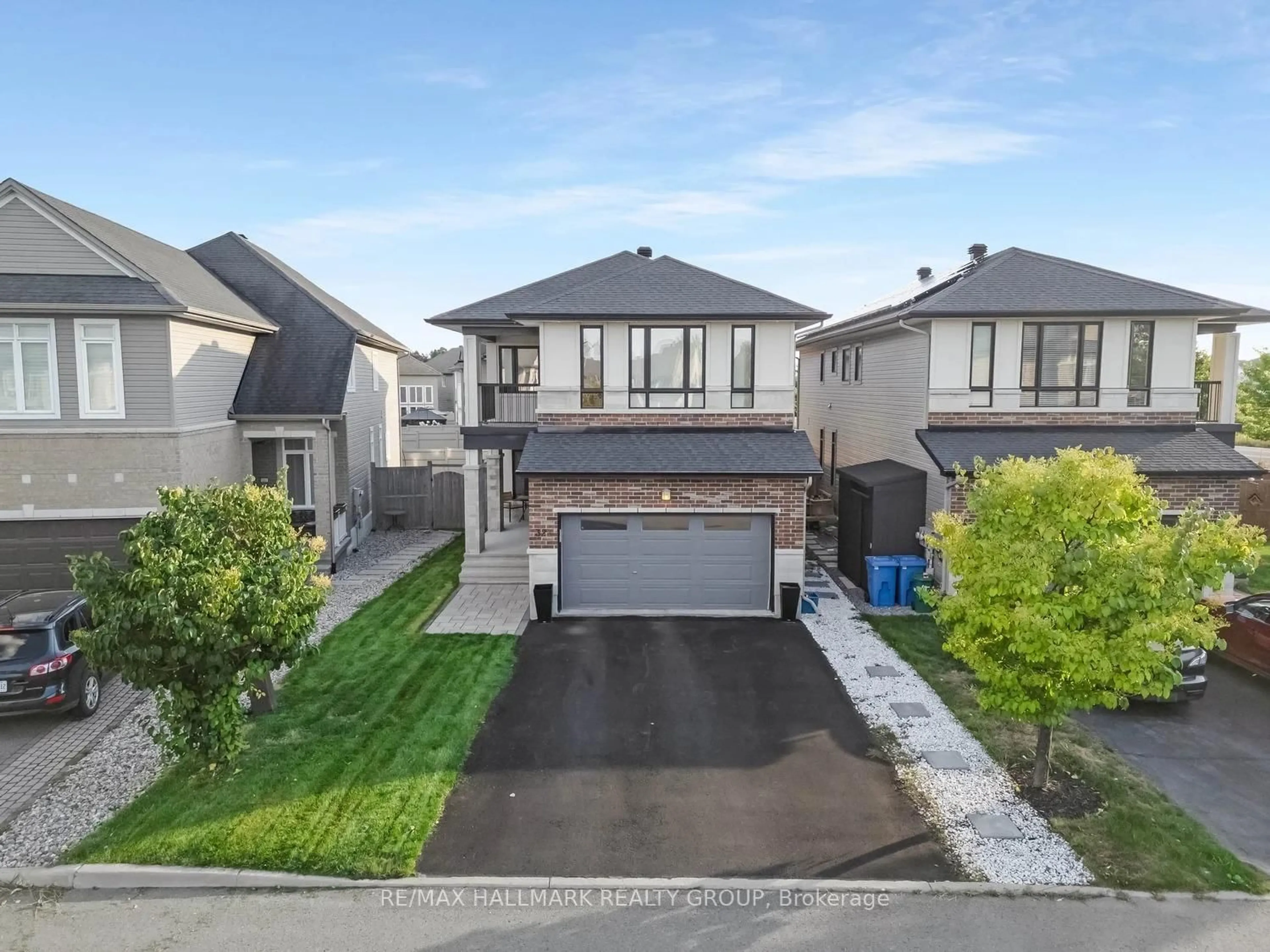 A pic from outside/outdoor area/front of a property/back of a property/a pic from drone, street for 327 BALLINVILLE Circ, Ottawa Ontario K4M 0C4