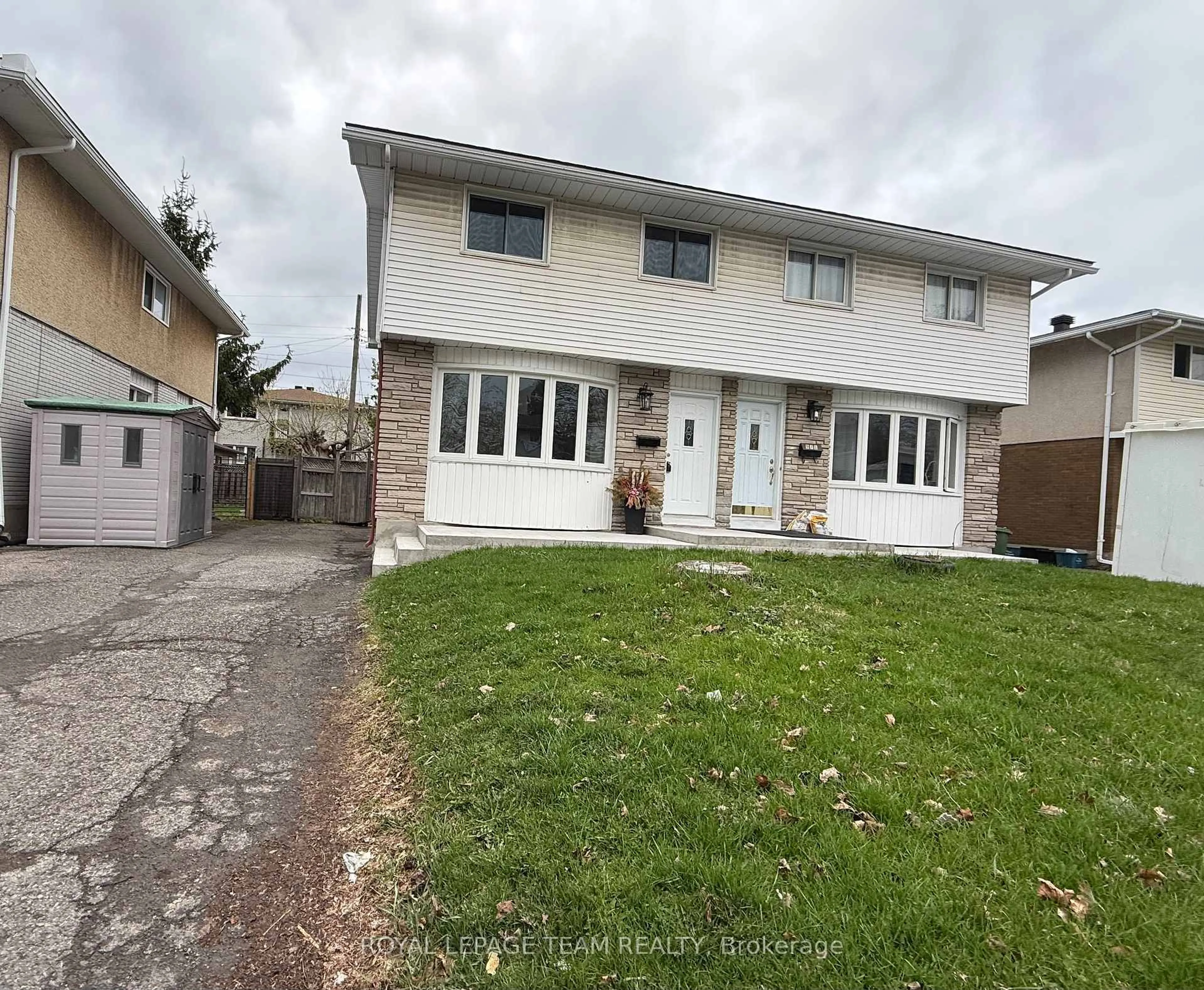 A pic from outside/outdoor area/front of a property/back of a property/a pic from drone, street for 973 Eiffel Ave, Ottawa Ontario K2C 0J3