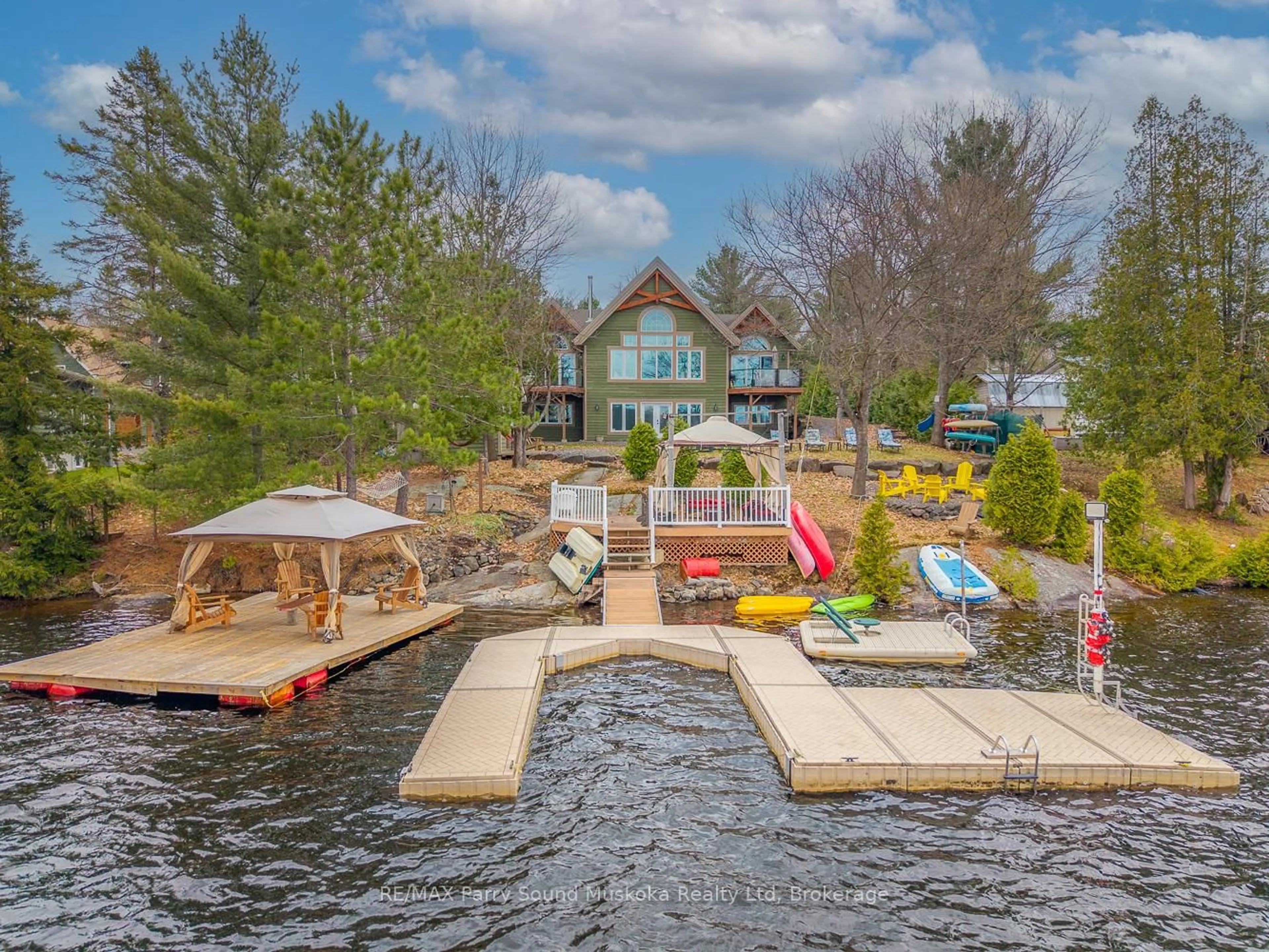 A pic from outside/outdoor area/front of a property/back of a property/a pic from drone, water/lake/river/ocean view for 61 Mckellar Lake Rd, McKellar Ontario P0G 1C0