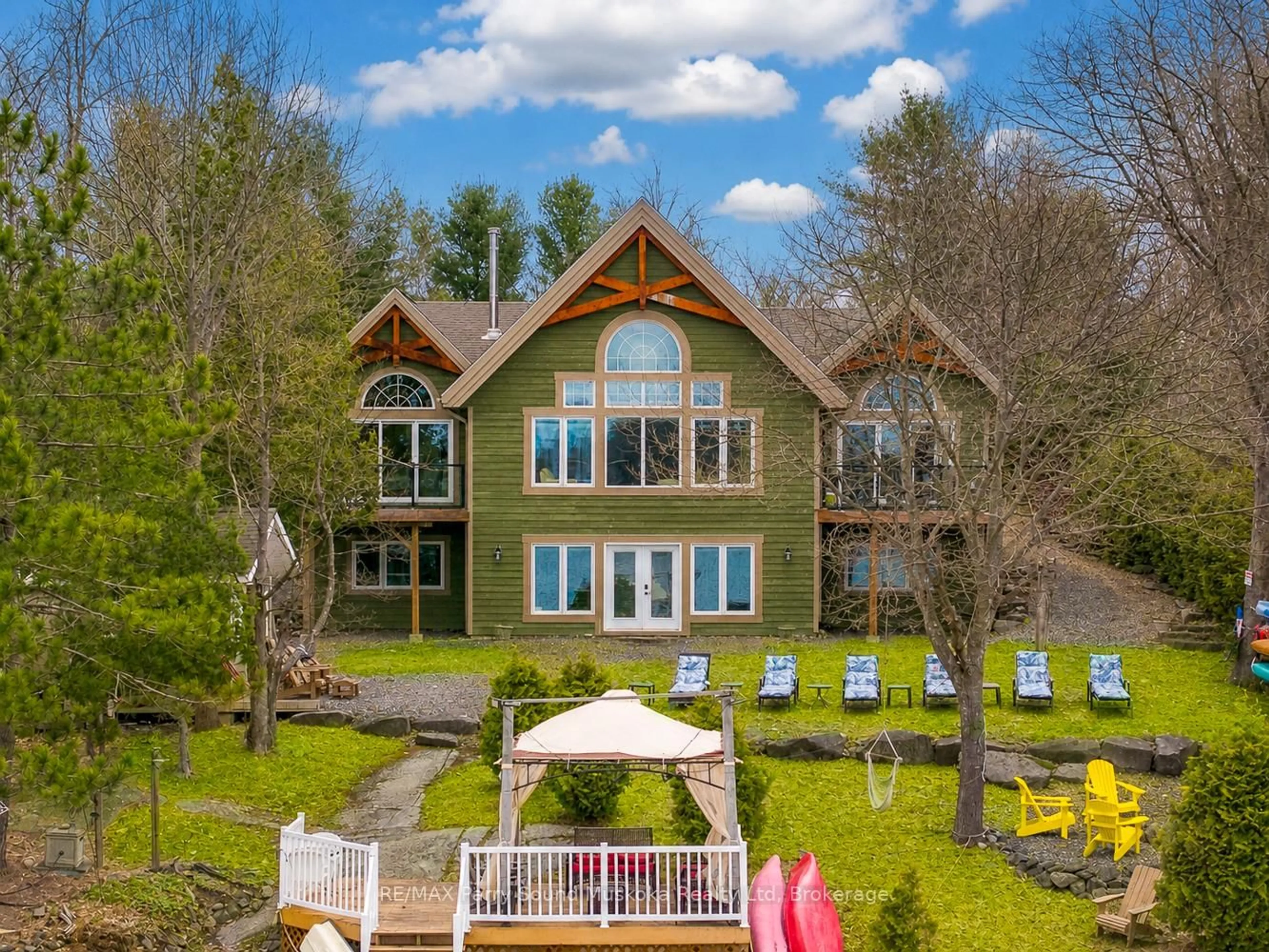 A pic from outside/outdoor area/front of a property/back of a property/a pic from drone, water/lake/river/ocean view for 61 Mckellar Lake Rd, McKellar Ontario P0G 1C0