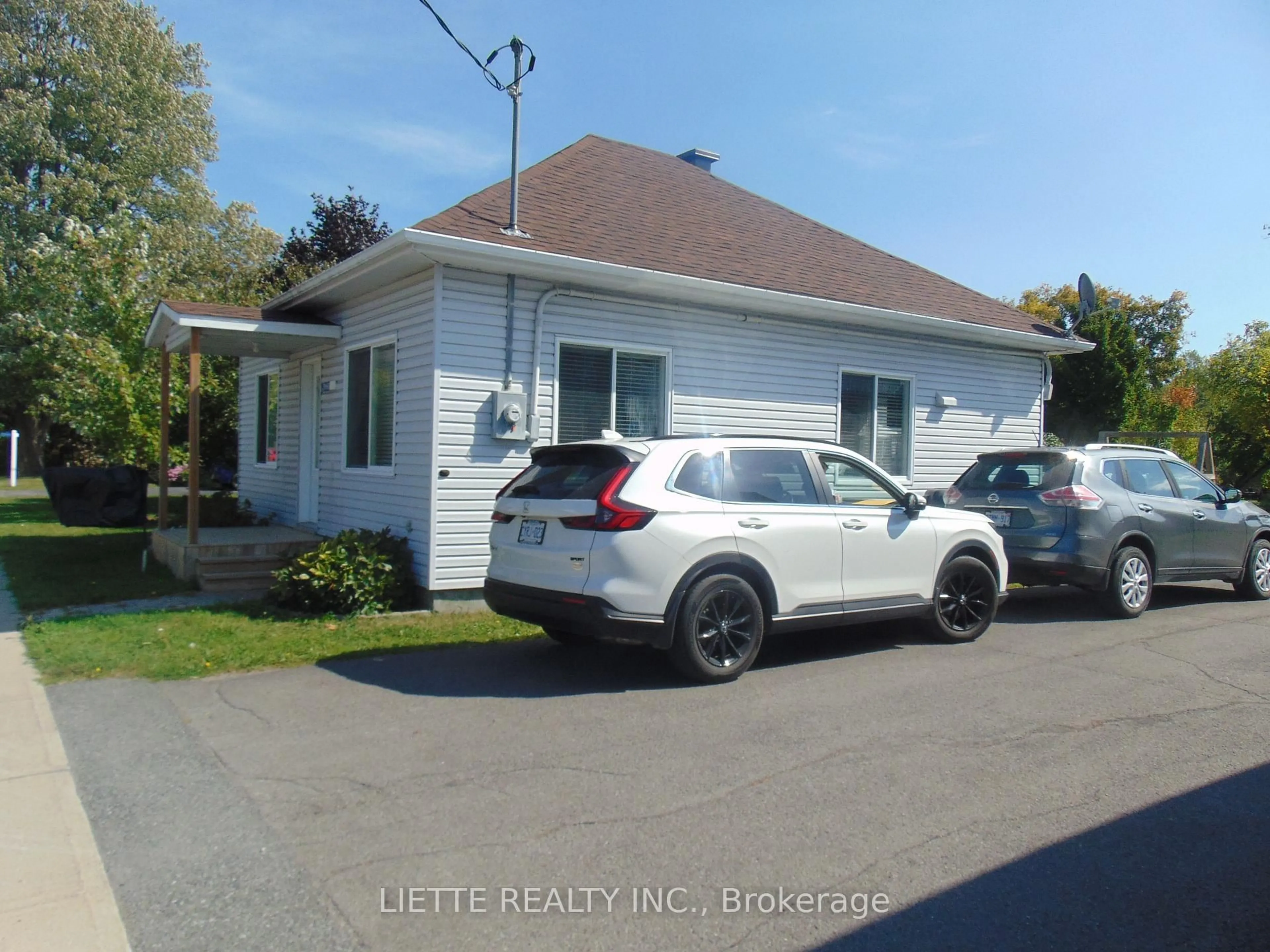 Home with vinyl exterior material, street for 21968 Main St, North Glengarry Ontario K0B 1H0