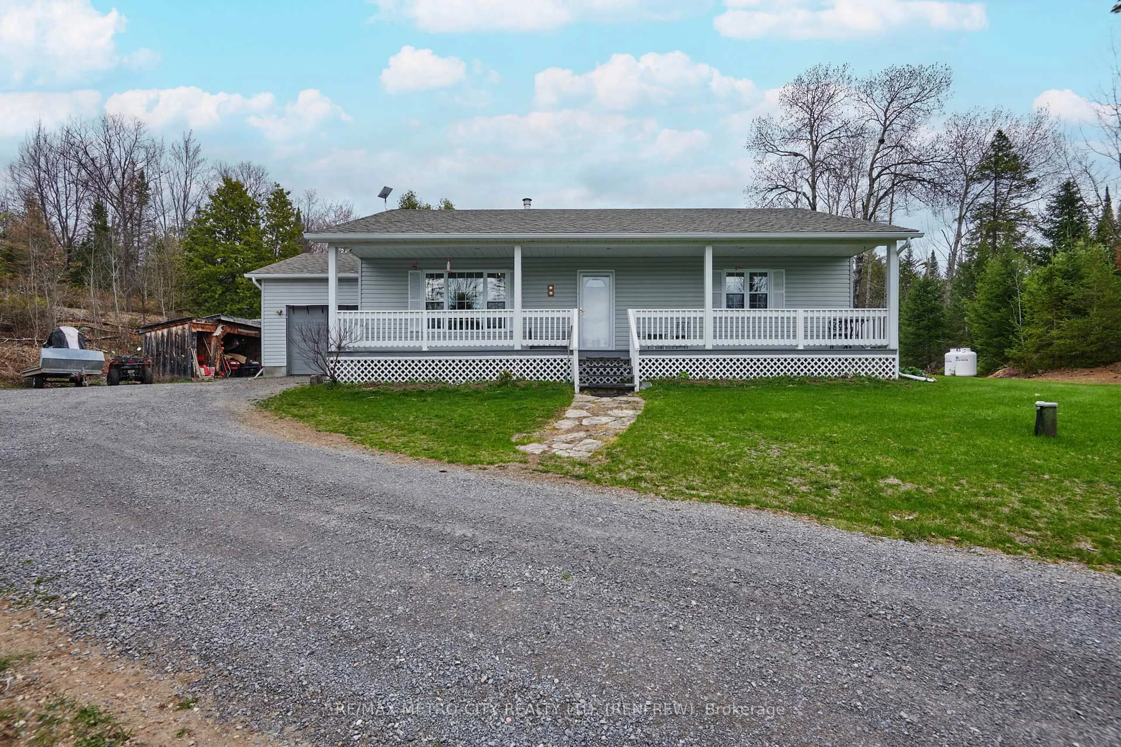 Home with vinyl exterior material, street for 1003 Grant Rd, Renfrew Ontario K7V 3Z9