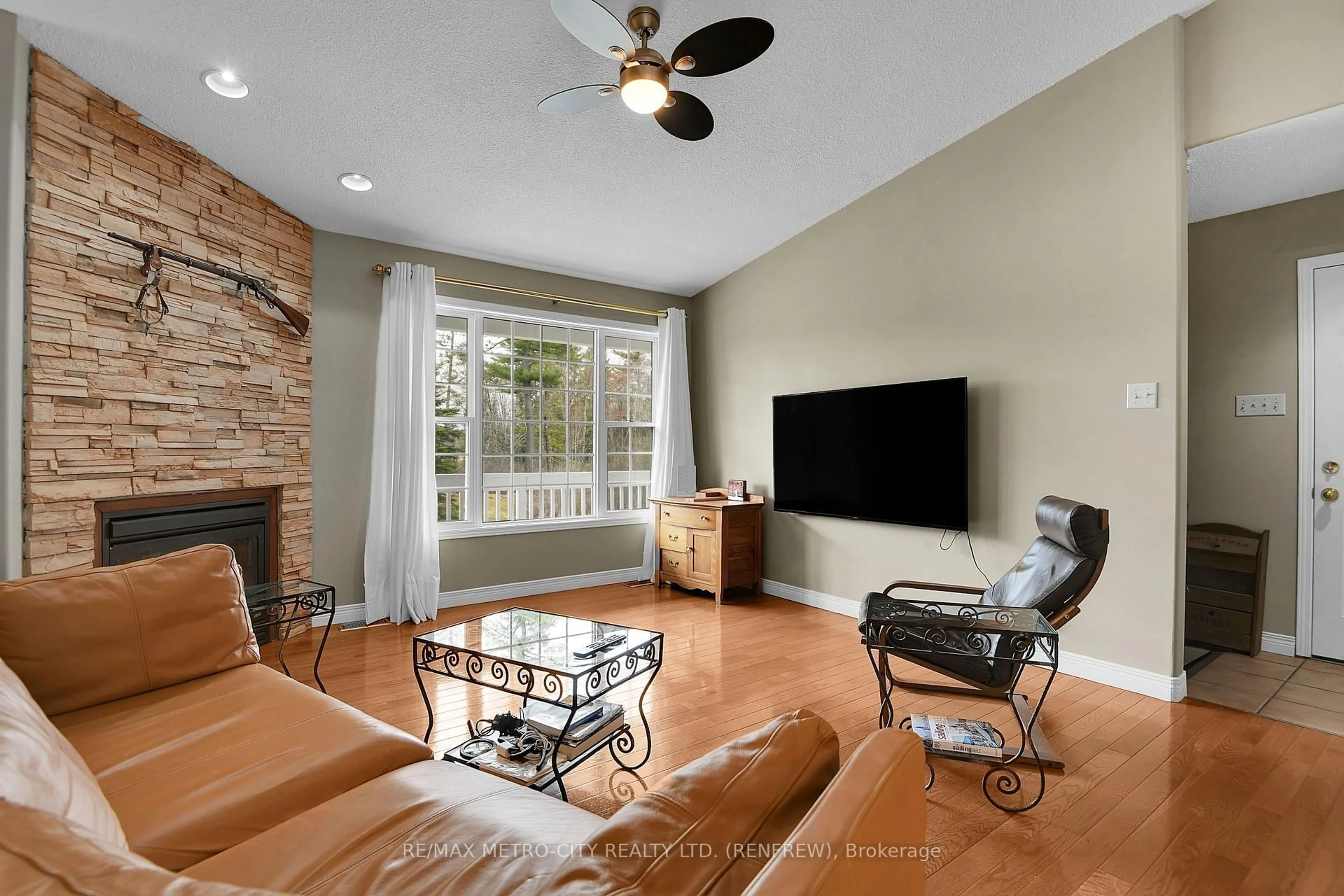 Living room with furniture, ceramic/tile floor for 1003 Grant Rd, Renfrew Ontario K7V 3Z9