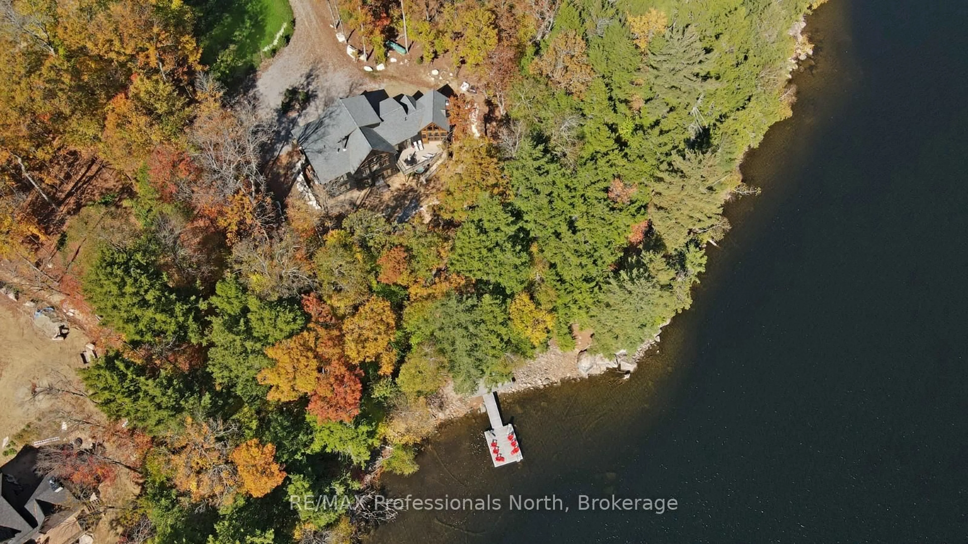 A pic from outside/outdoor area/front of a property/back of a property/a pic from drone, water/lake/river/ocean view for 1410 Flatwater Cove Tr, Dysart et al Ontario K0M 1S0