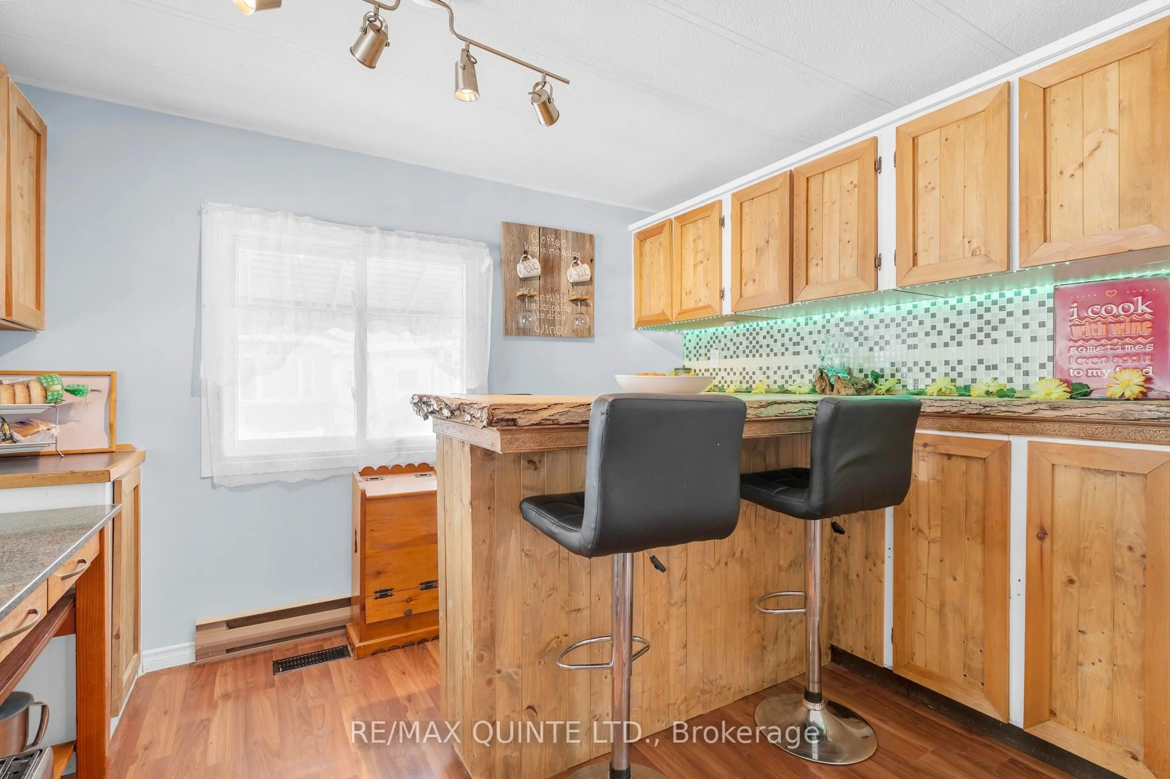 Open concept kitchen, wood/laminate floor for 311 Dundas St #56, Quinte West Ontario K8V 1M1