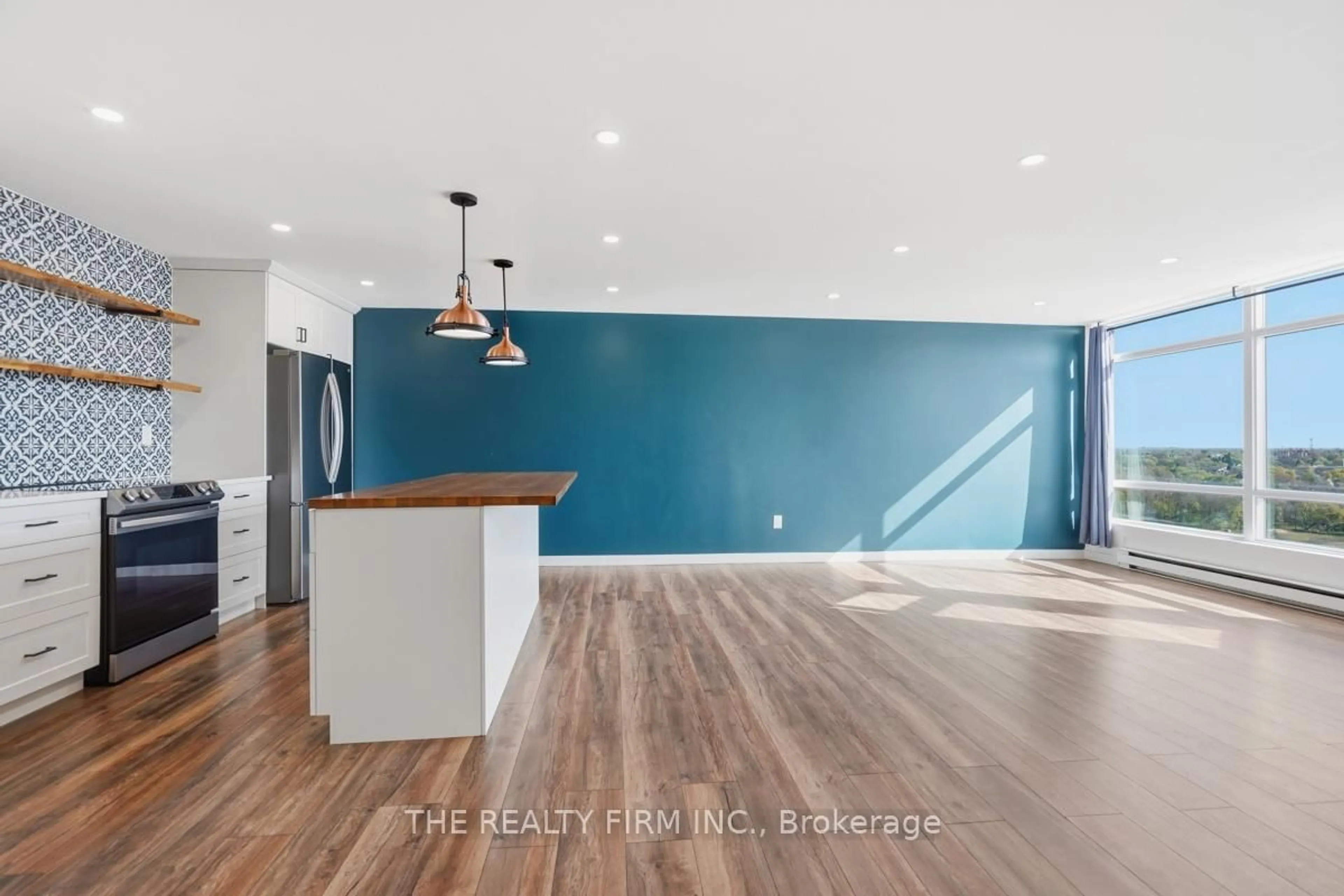 Open concept kitchen, wood/laminate floor for 45 Pond Mills Rd #1210, London South Ontario N5Z 4W5