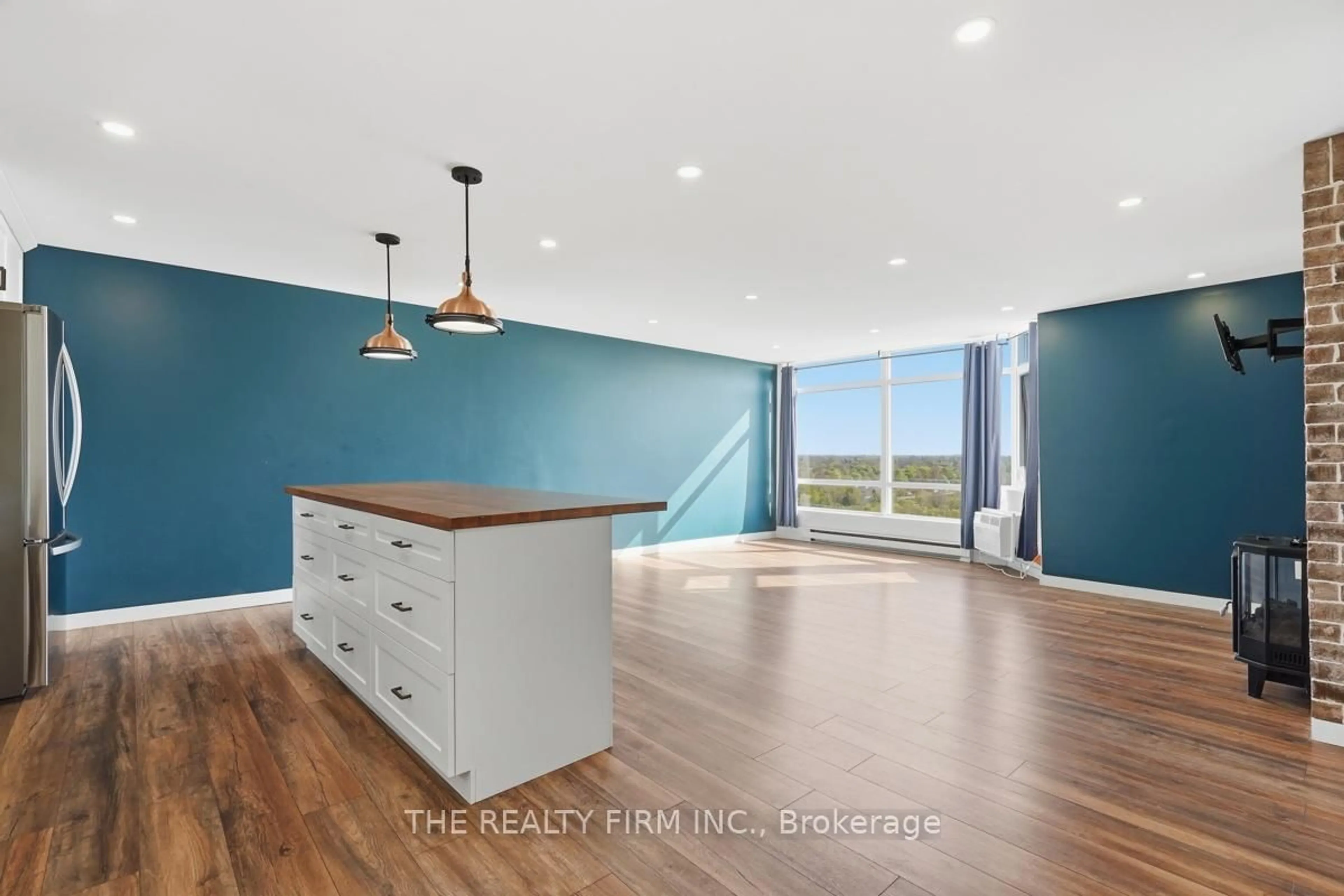 Open concept kitchen, wood/laminate floor for 45 Pond Mills Rd #1210, London South Ontario N5Z 4W5