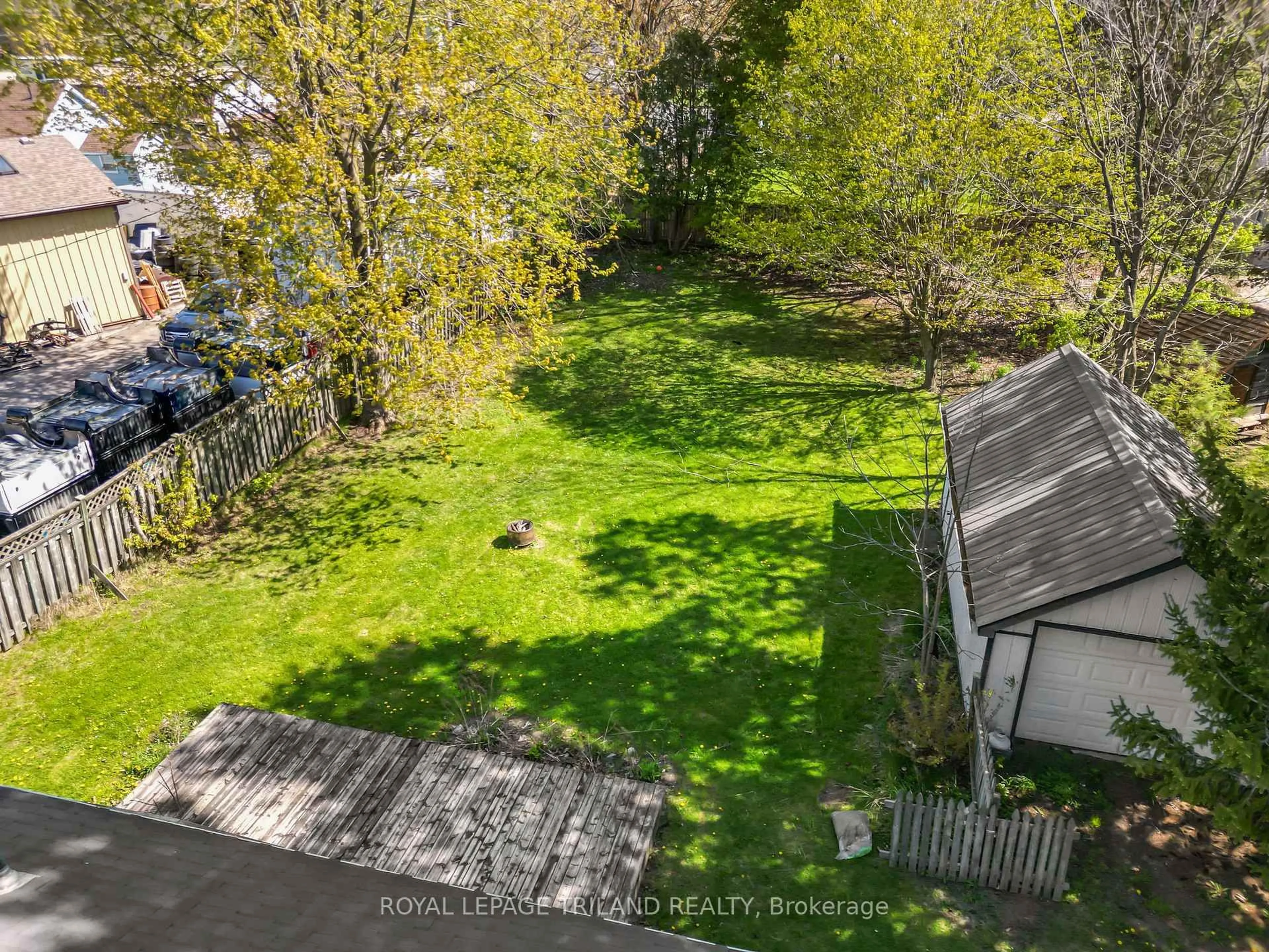 A pic from outside/outdoor area/front of a property/back of a property/a pic from drone, forest/trees view for 185 Main St, Southwest Middlesex Ontario N0L 1M0