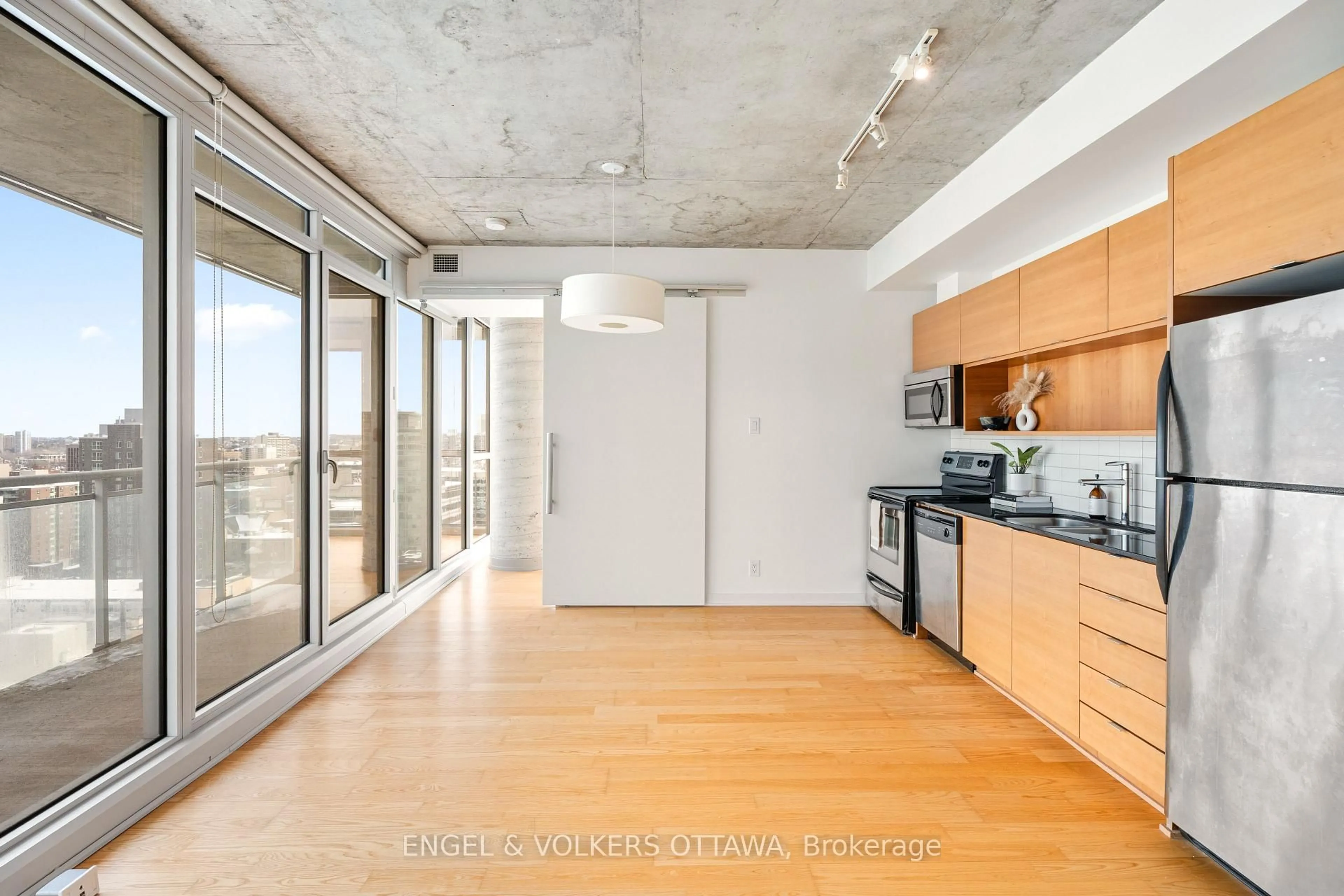 Open concept kitchen, cement floor for 324 Laurier Ave #1610, Ottawa Ontario K1P 0A4