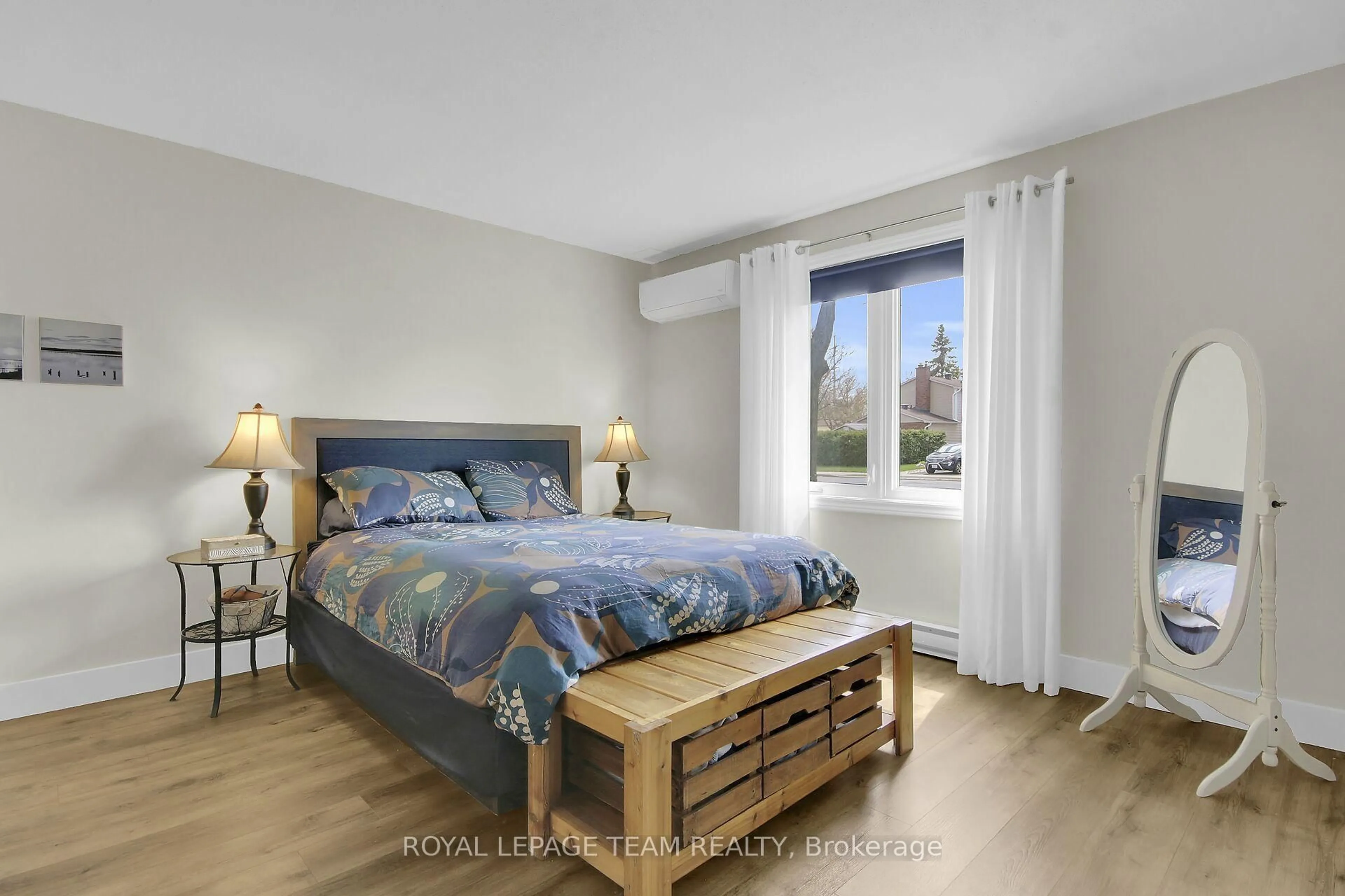 Bedroom with bed, wood/laminate floor for 3B Harness Lane, Ottawa Ontario K2M 1E1