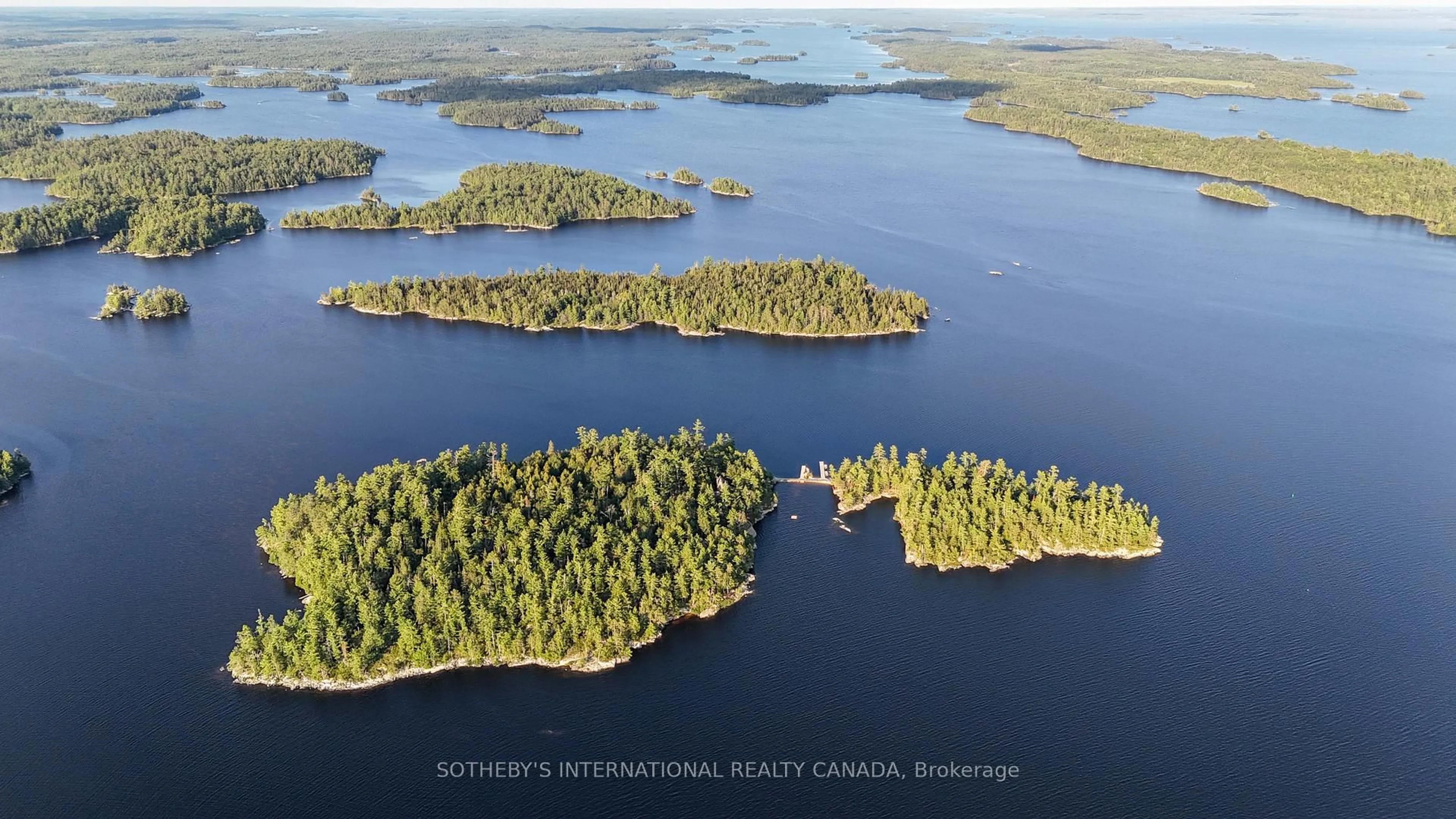 A pic from outside/outdoor area/front of a property/back of a property/a pic from drone, water/lake/river/ocean view for 1 French Island, Rainy River Ontario P0W 1L0