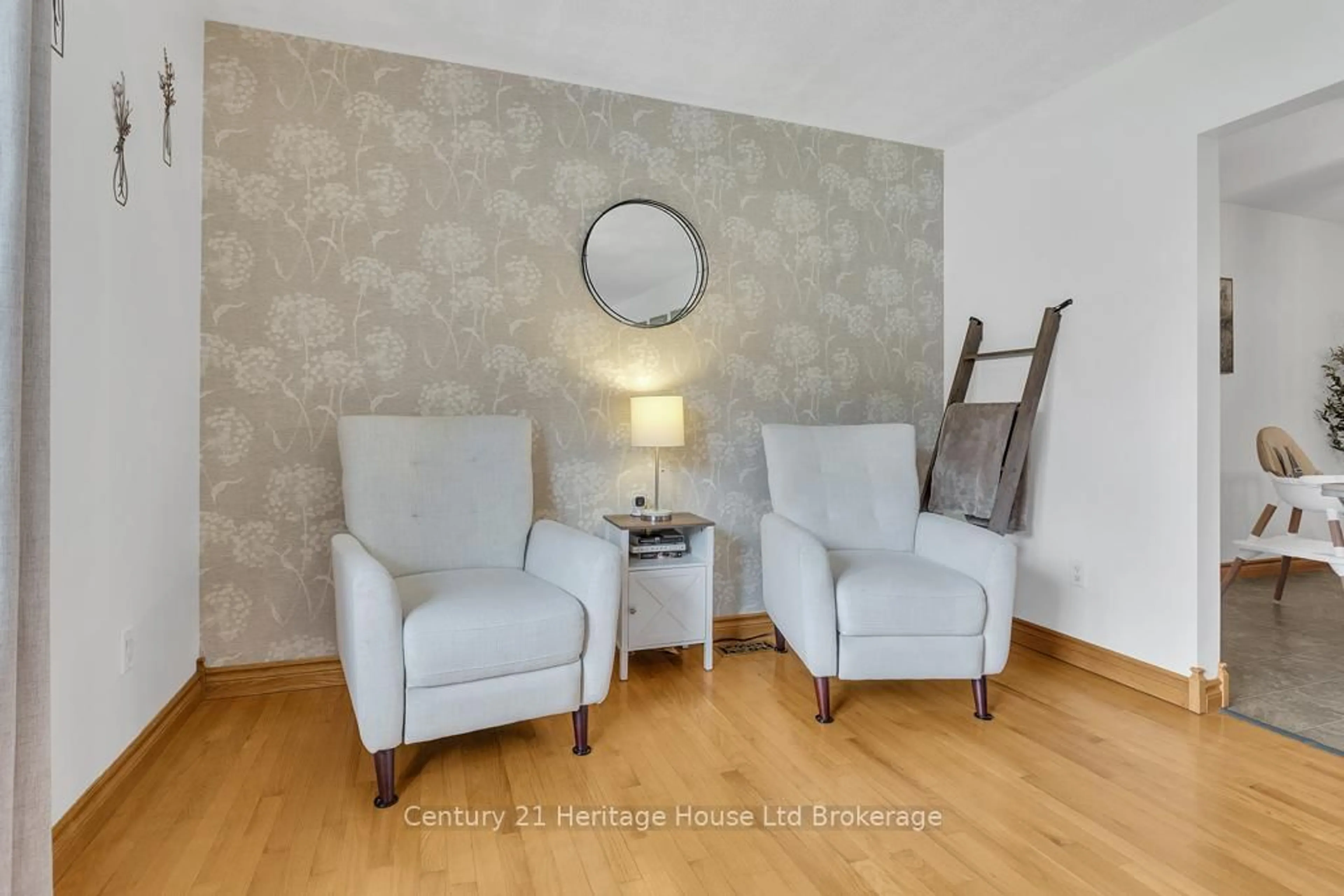 Living room with furniture, wood/laminate floor for 1668 Perth 123 Rd, Perth South Ontario N4X 1C6