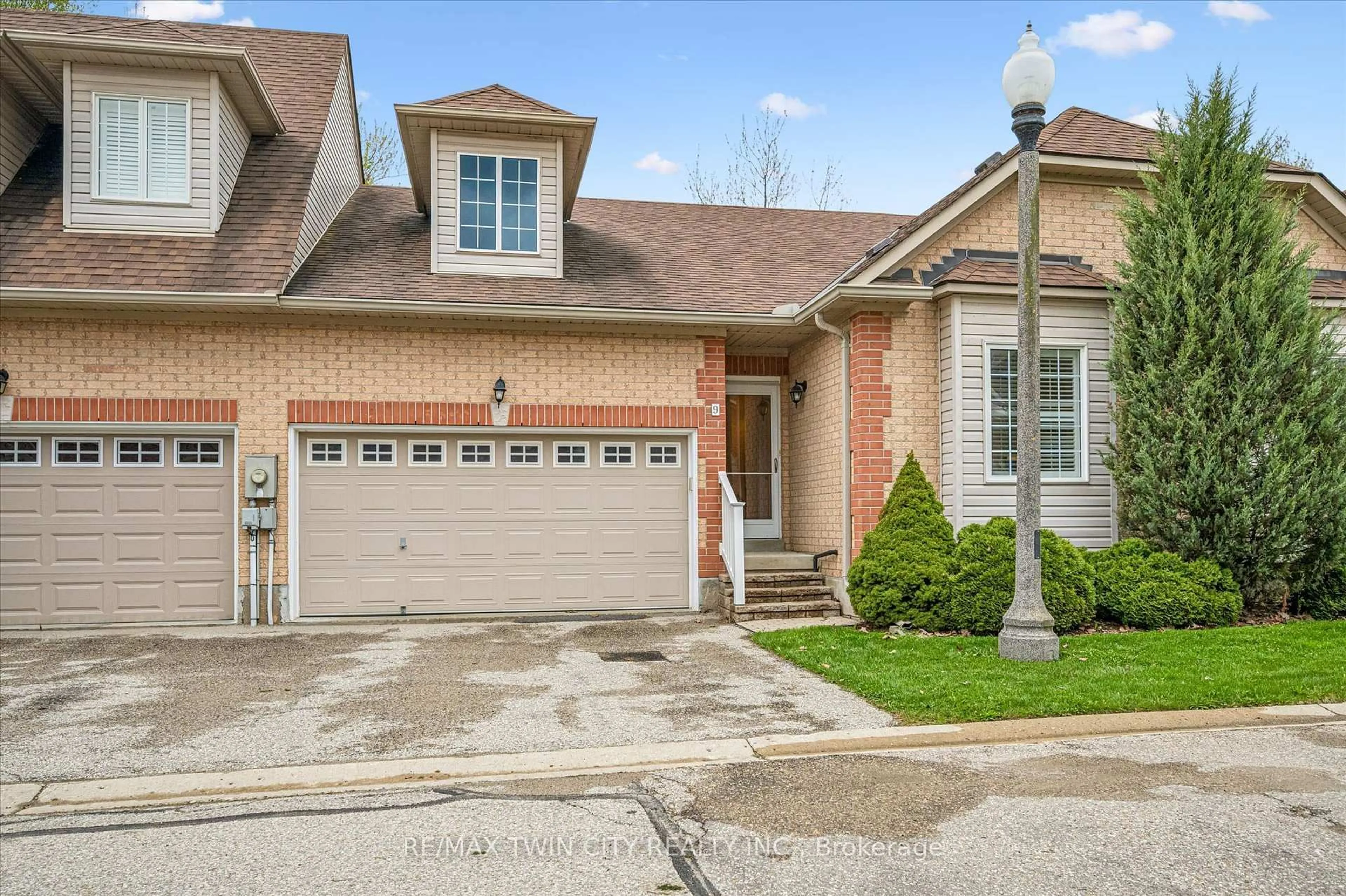 Home with brick exterior material, street for 100 Idle Creek Dr #9, Kitchener Ontario N2A 4H3