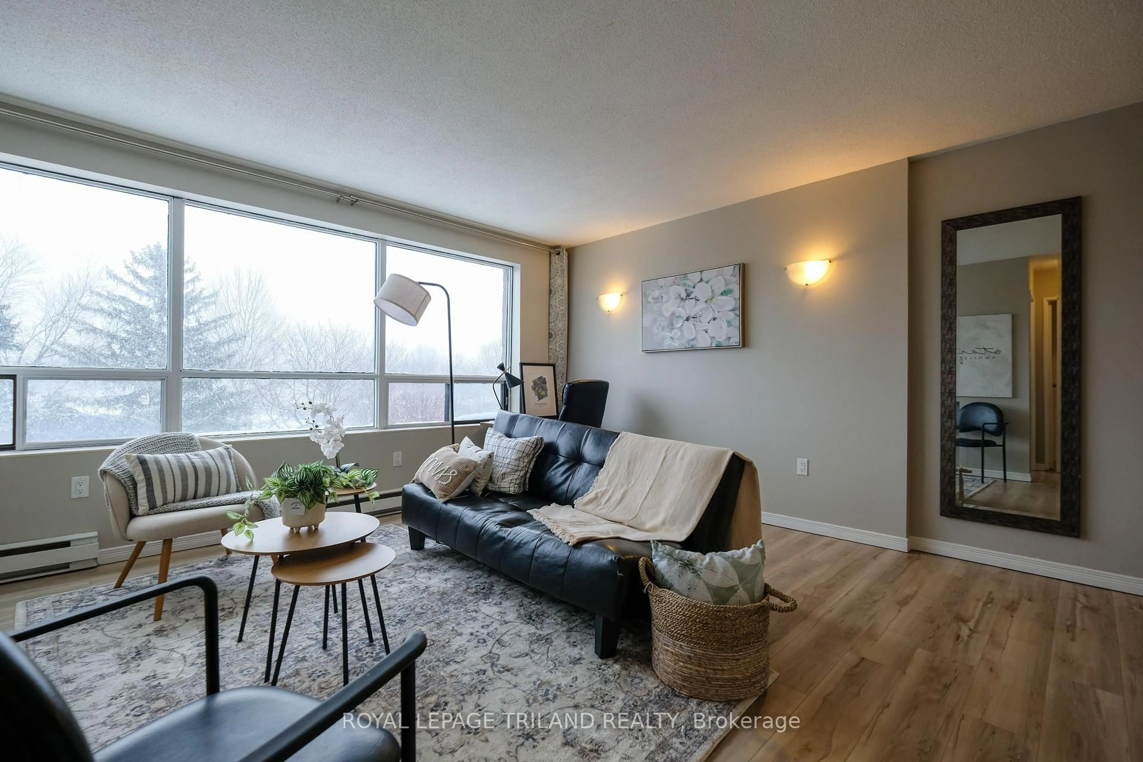 Living room with furniture, wood/laminate floor for 650 Cheapside St #605, London North Ontario N5Y 5J8