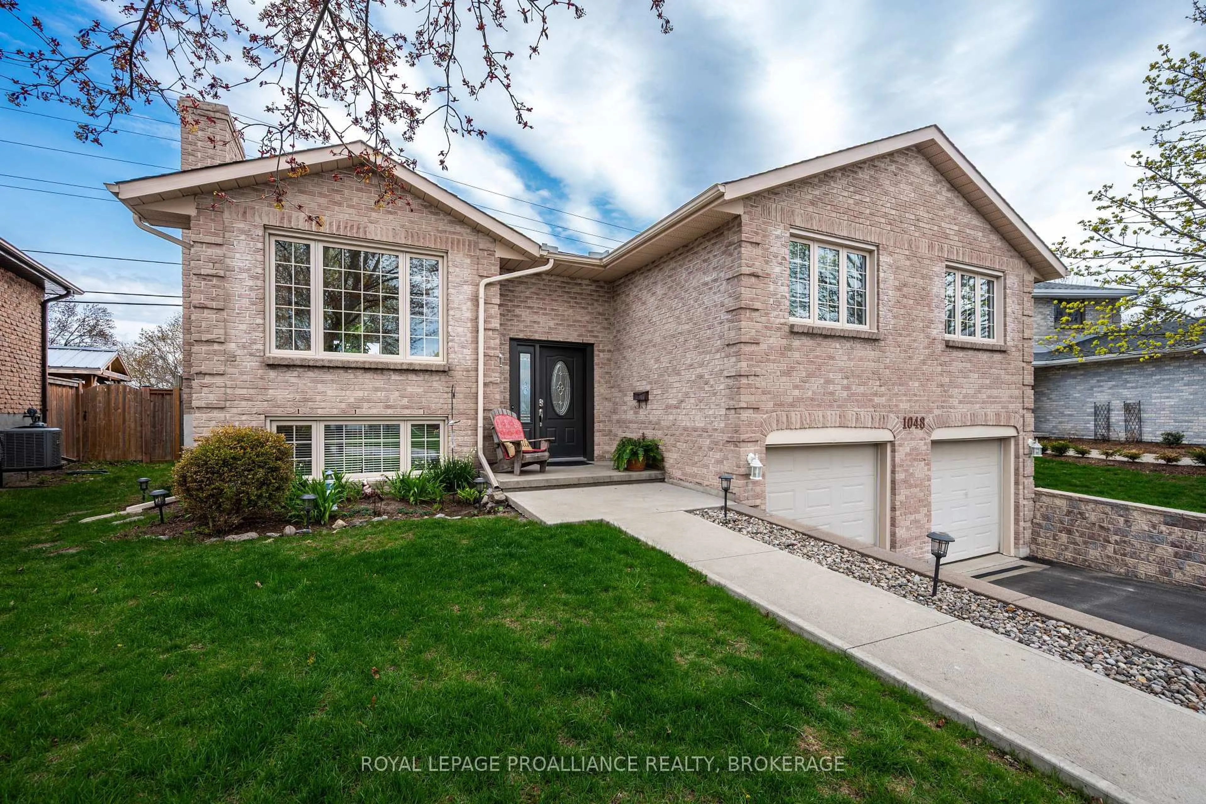 Home with brick exterior material, street for 1048 Palmerston Cres, Kingston Ontario K7P 2P5